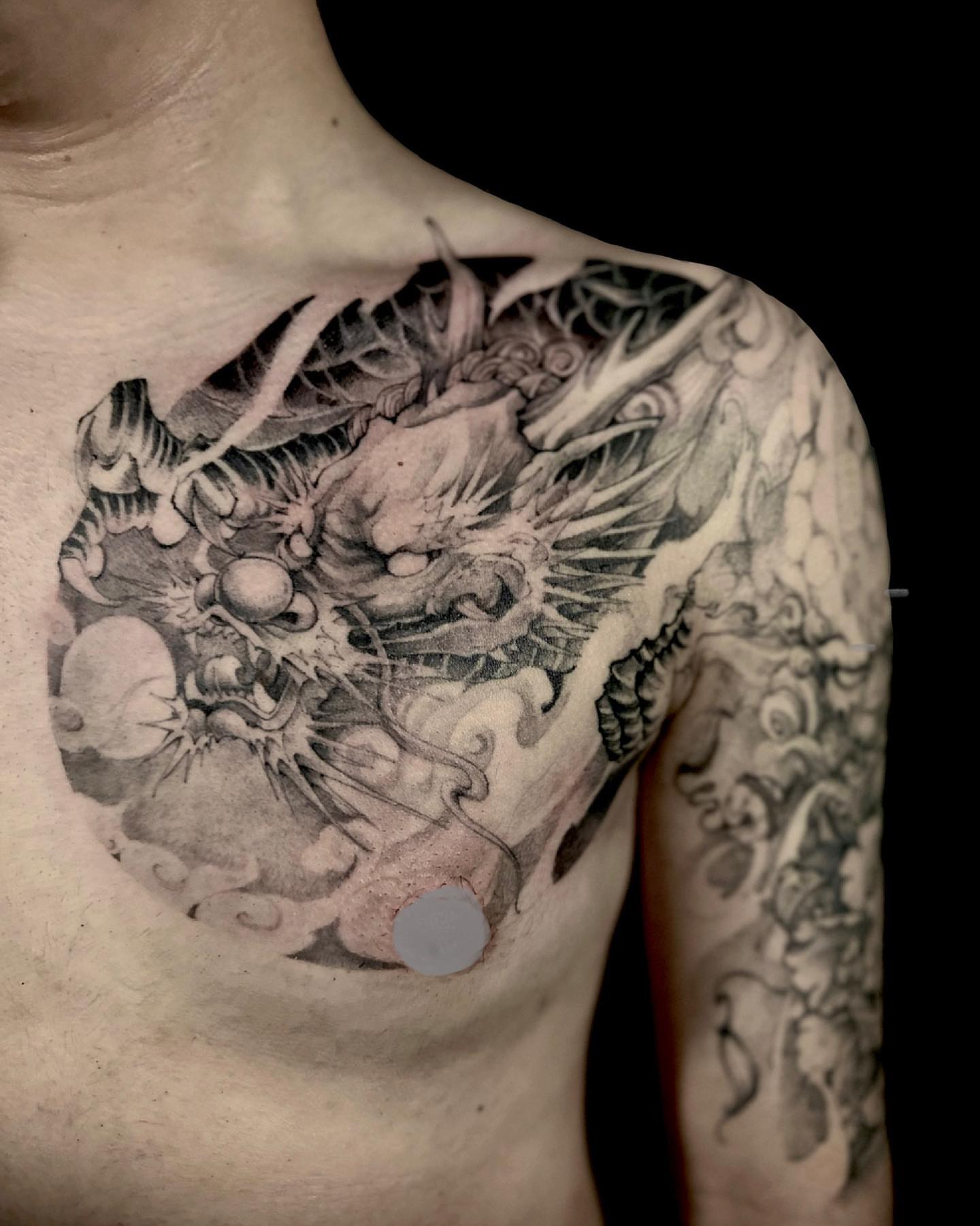 Dragon and clouds realism tattoo on the chest by Shihao zhao