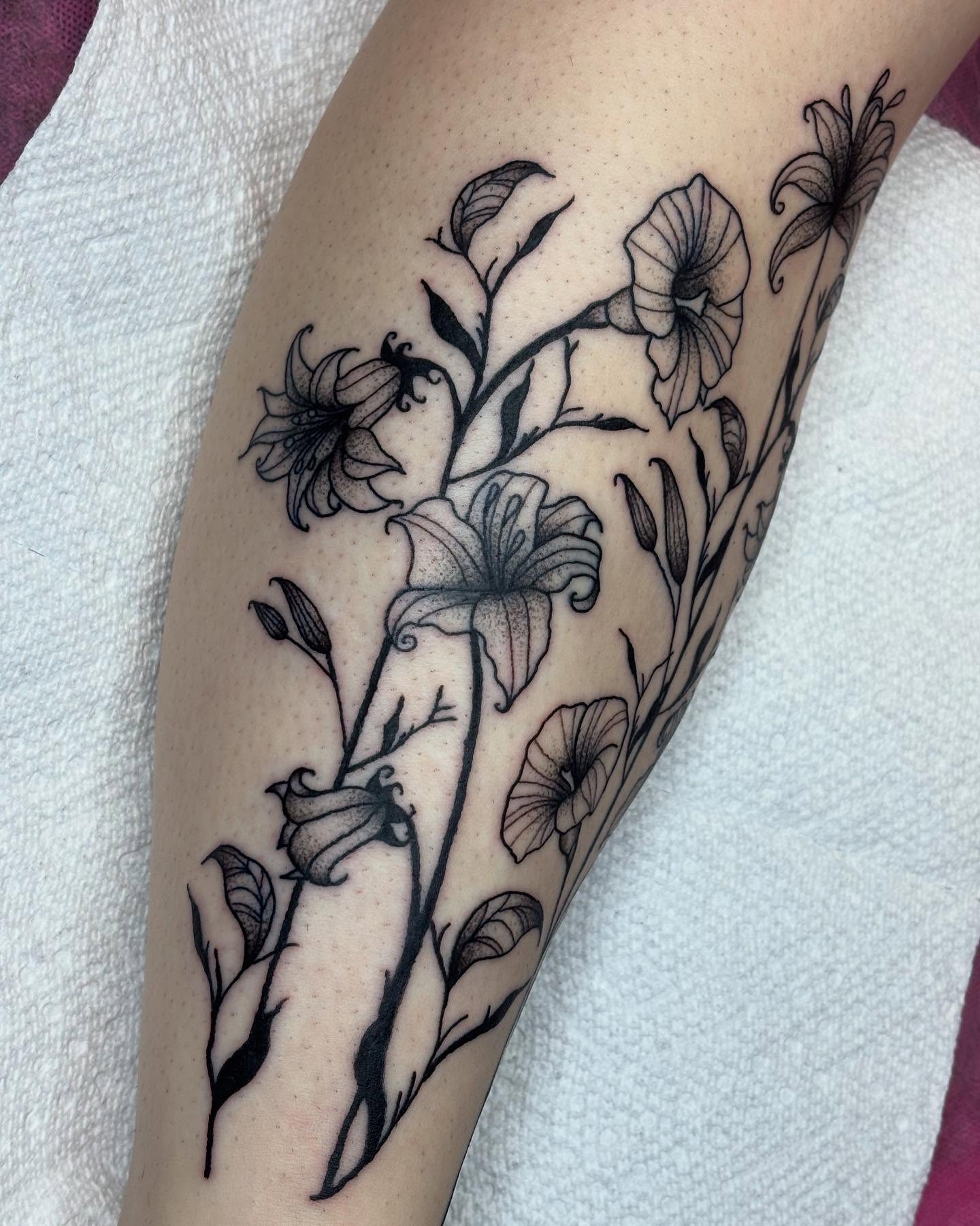 Floral arrangement black and grey tattoo on the forearm by kylie