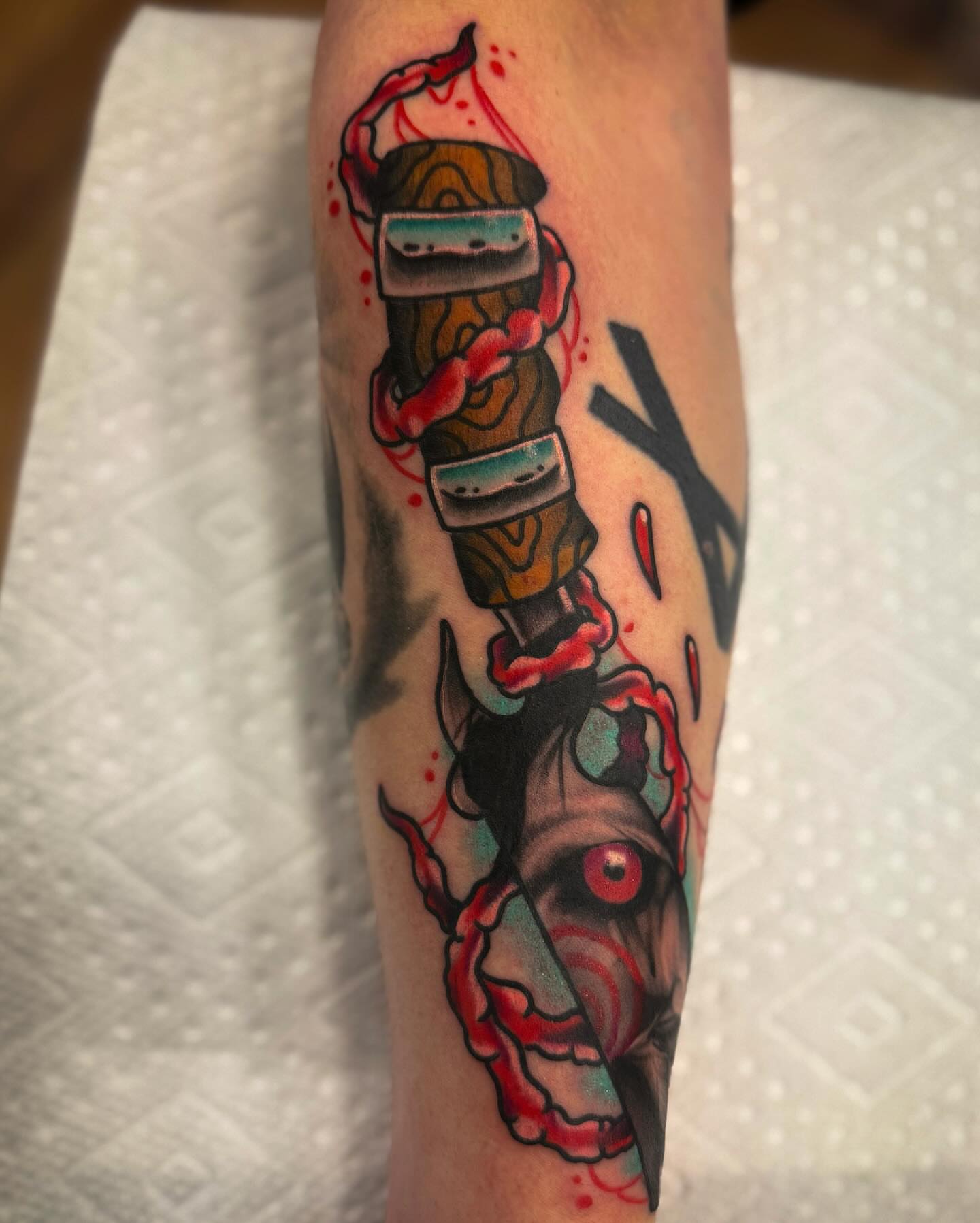 Knife with eye American traditional tattoo on the forearm by Sam Babcock