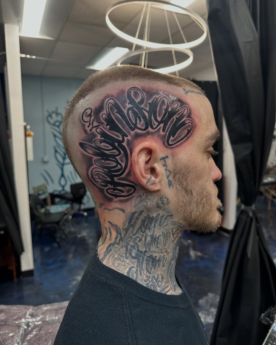 Script lettering on head Chicano tattoo on the head by Christian Colón, Nashville, Tennessee