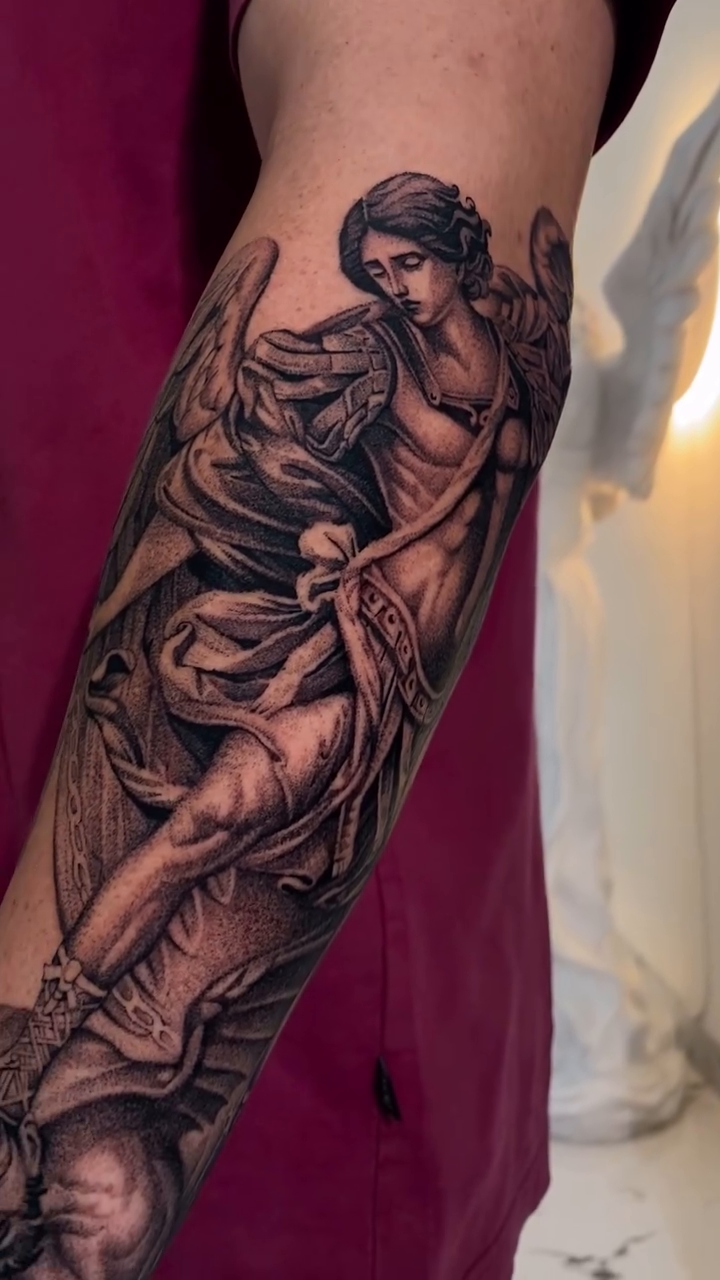 Angel with scroll realism tattoo by Viktor Govorukhin