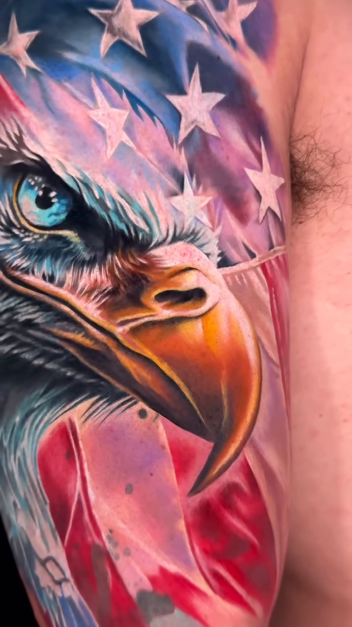 Eagle with American flag realism tattoo by Noelin Wheeler