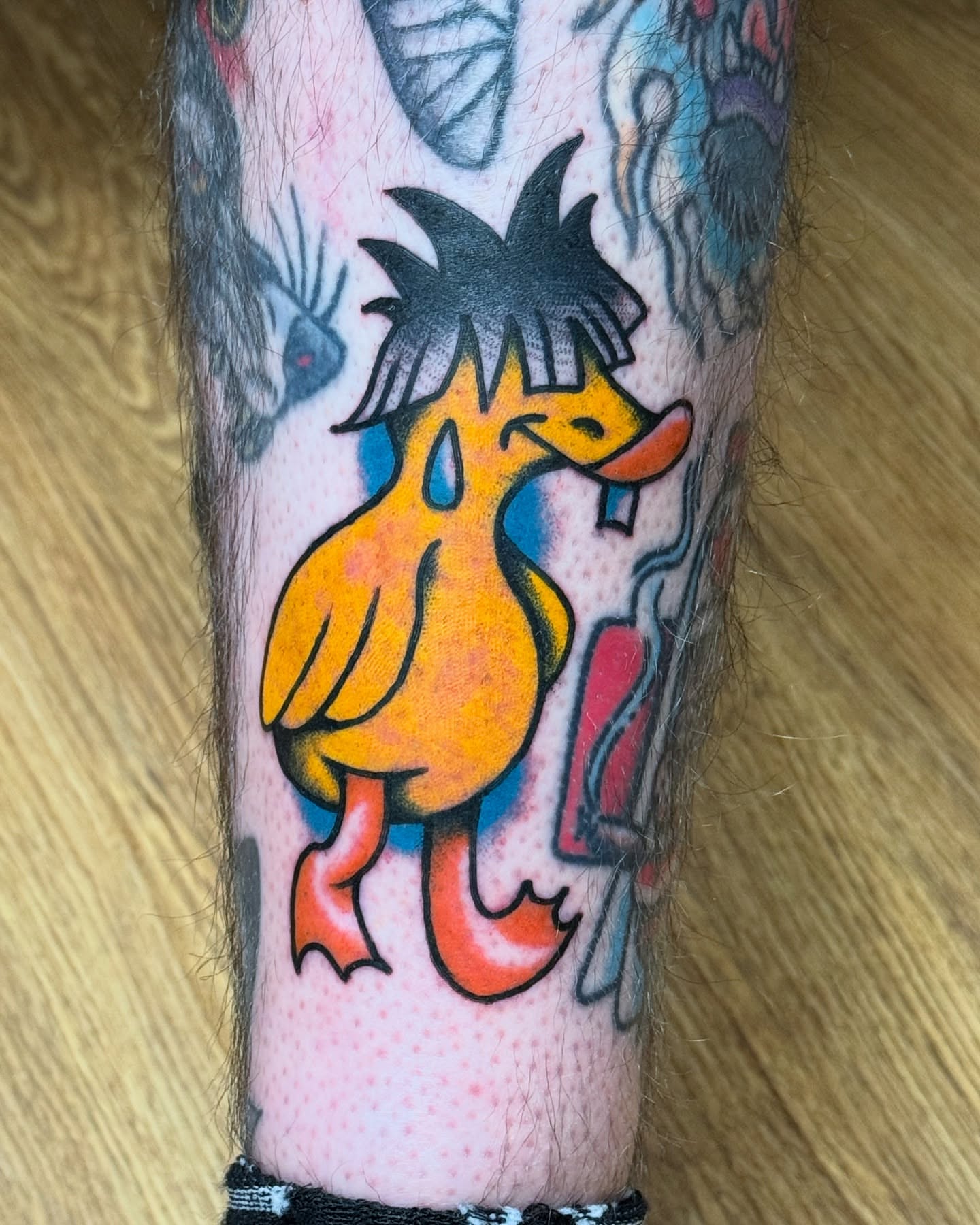Duck American traditional tattoo on the forearm by Dave Shurman