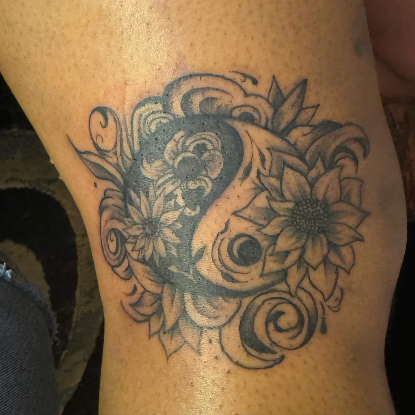 Sunflowers and swirls black and grey tattoo on the thigh by Aja Marie