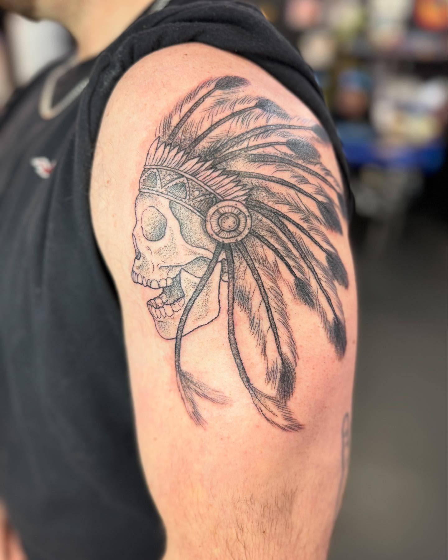 Skull headdress dotwork tattoo on the shoulder by Marissa Losier