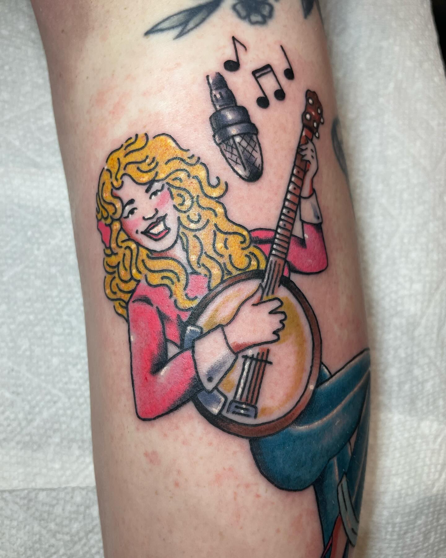 Banjo player American traditional tattoo on the forearm by Chrissy Ungrew Tattoos, Covington, Kentucky