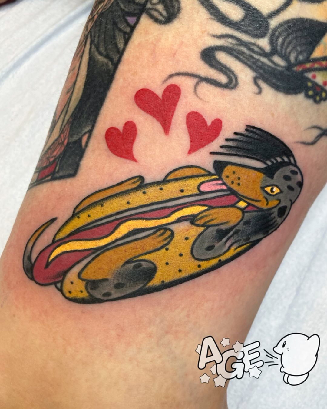 Hot dog American traditional tattoo on the forearm by Otaku and Gamer Tattooer