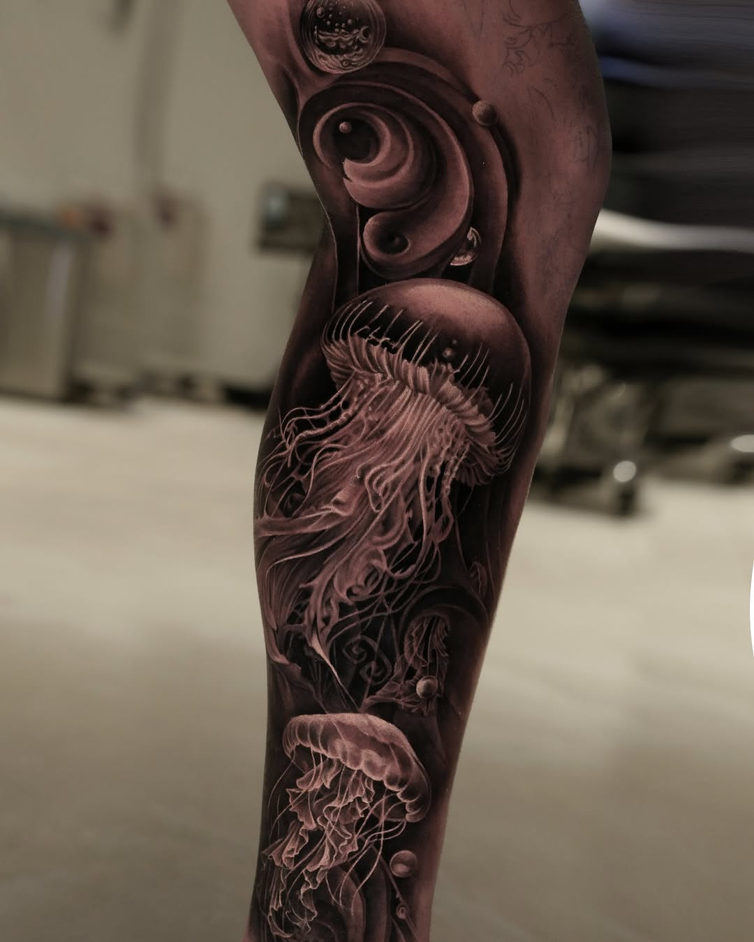 Jellyfish and abstract elements surrealism tattoo on the forearm by @_garart_