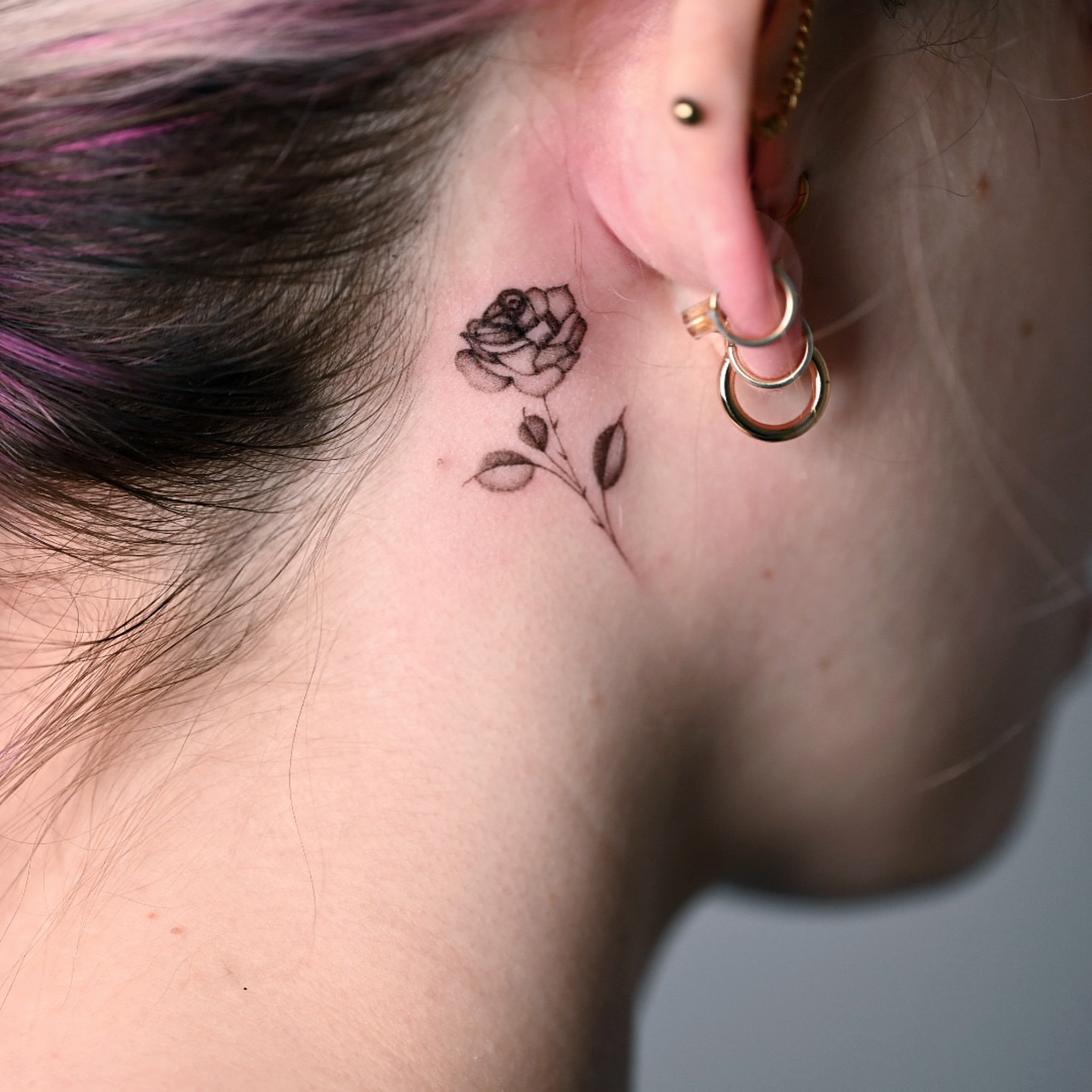 Rose black and grey tattoo on the neck by dom
