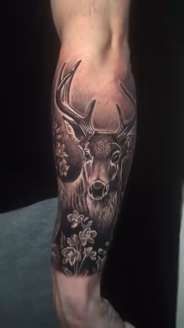 Deer with flowers realism tattoo by Jose Calderon