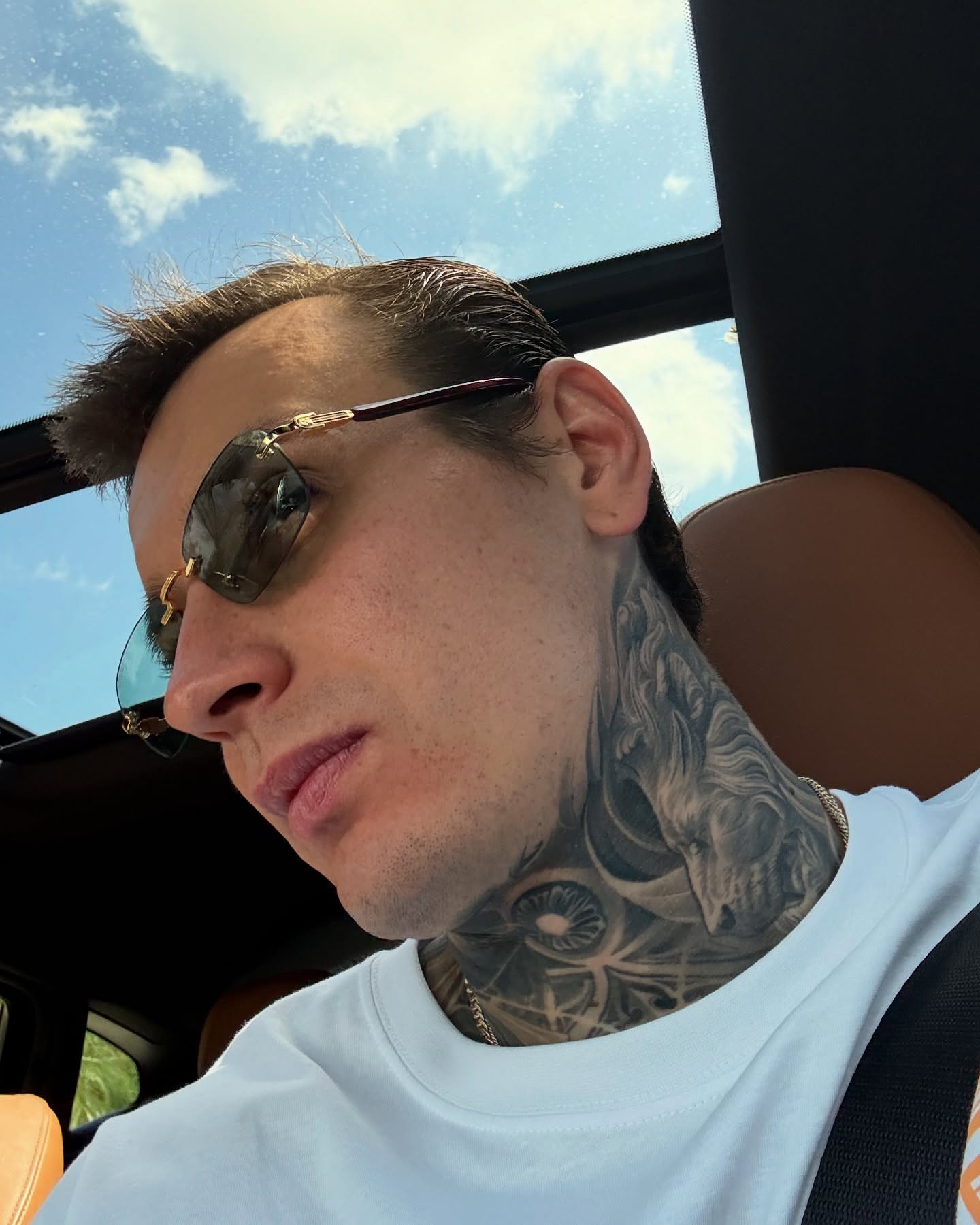 Bird black and grey tattoo on the neck by Artem Kunakuzin