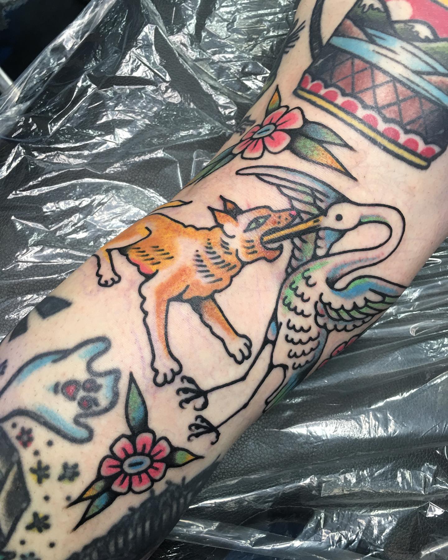 Fox and crane American traditional tattoo on the forearm by Abbey Martin, Nashville, Tennessee