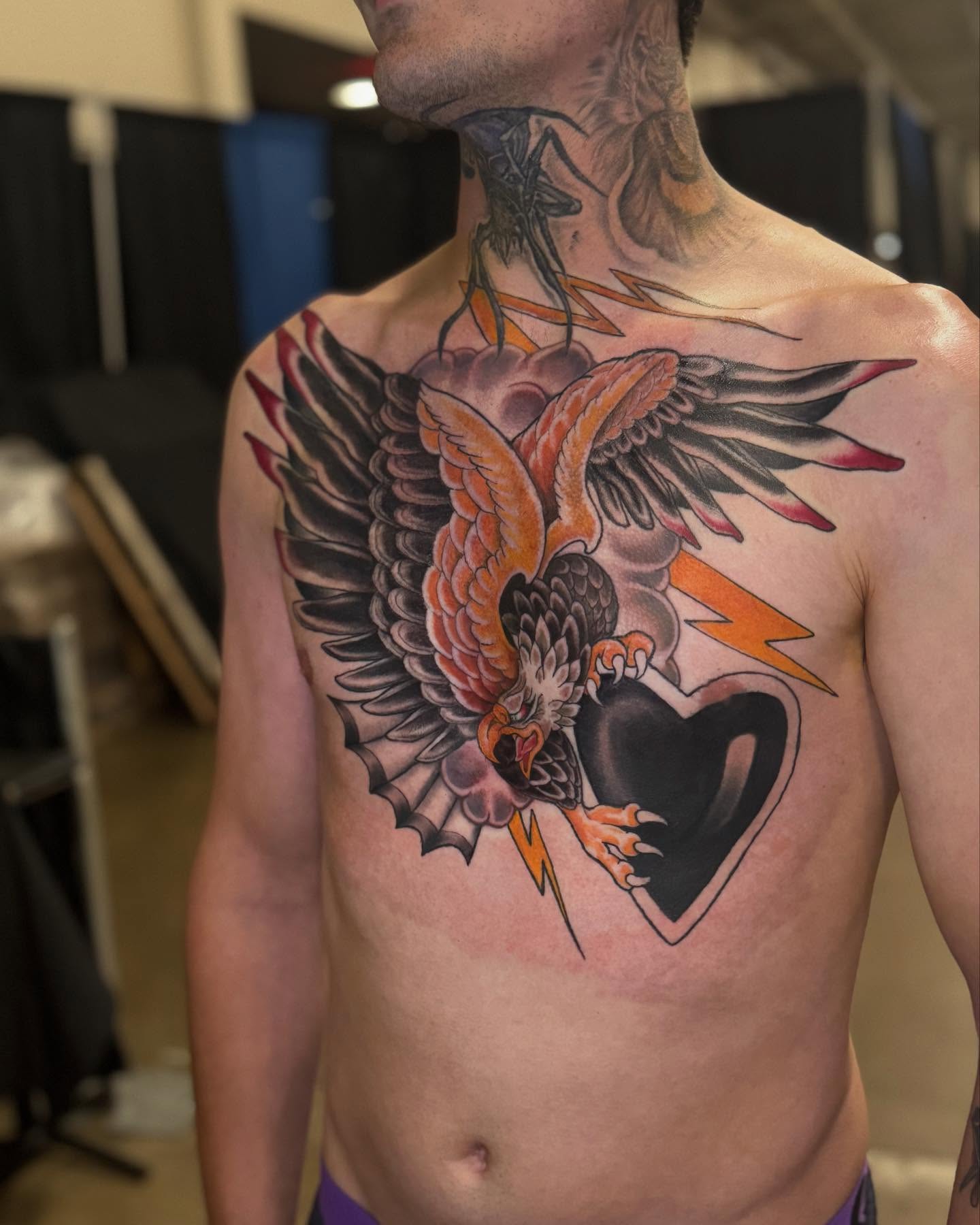 Eagle and heart American traditional tattoo on the chest by Brandon Seven