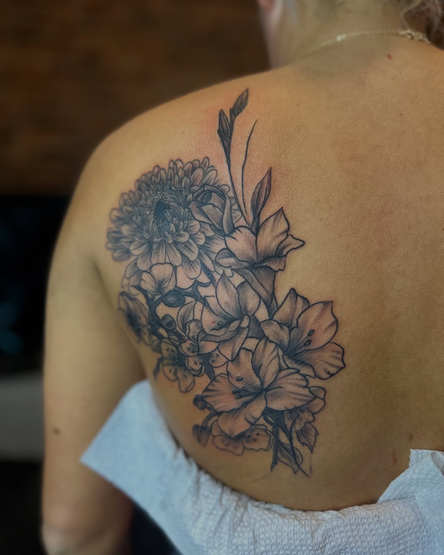 Flowers black and grey tattoo on the shoulder by Inked By E, Philadelphia, Pennsylvania