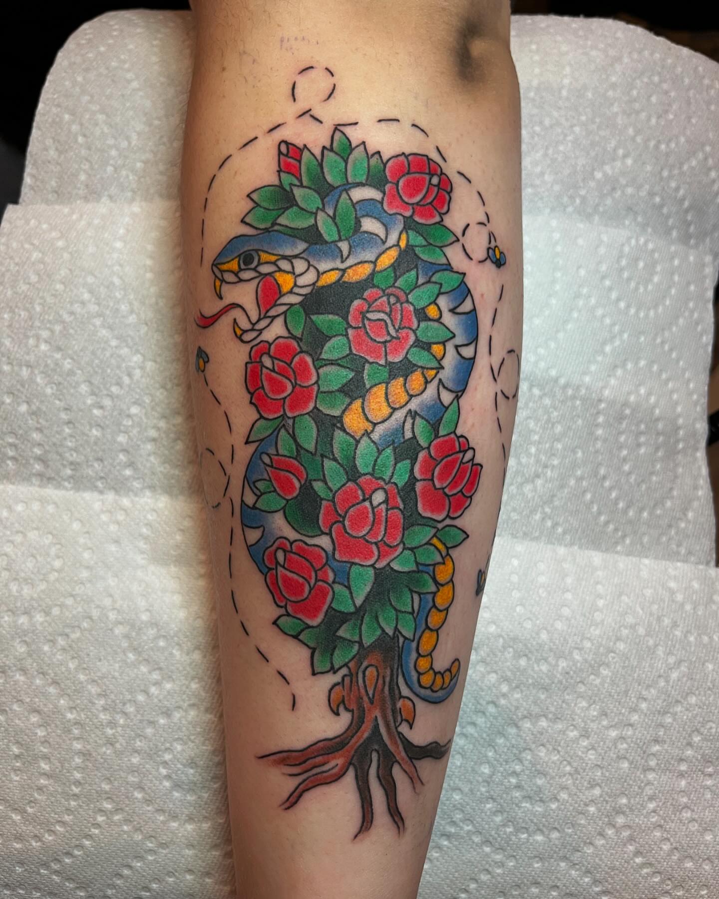 Peony and snake American traditional tattoo on the forearm by Brian Mcfadden