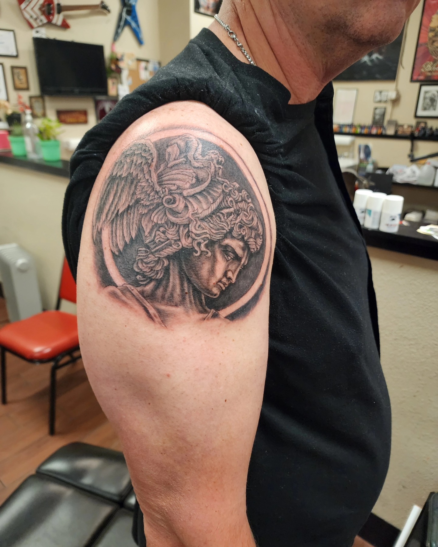 Medusa realism tattoo on the shoulder by Jeff Frederick