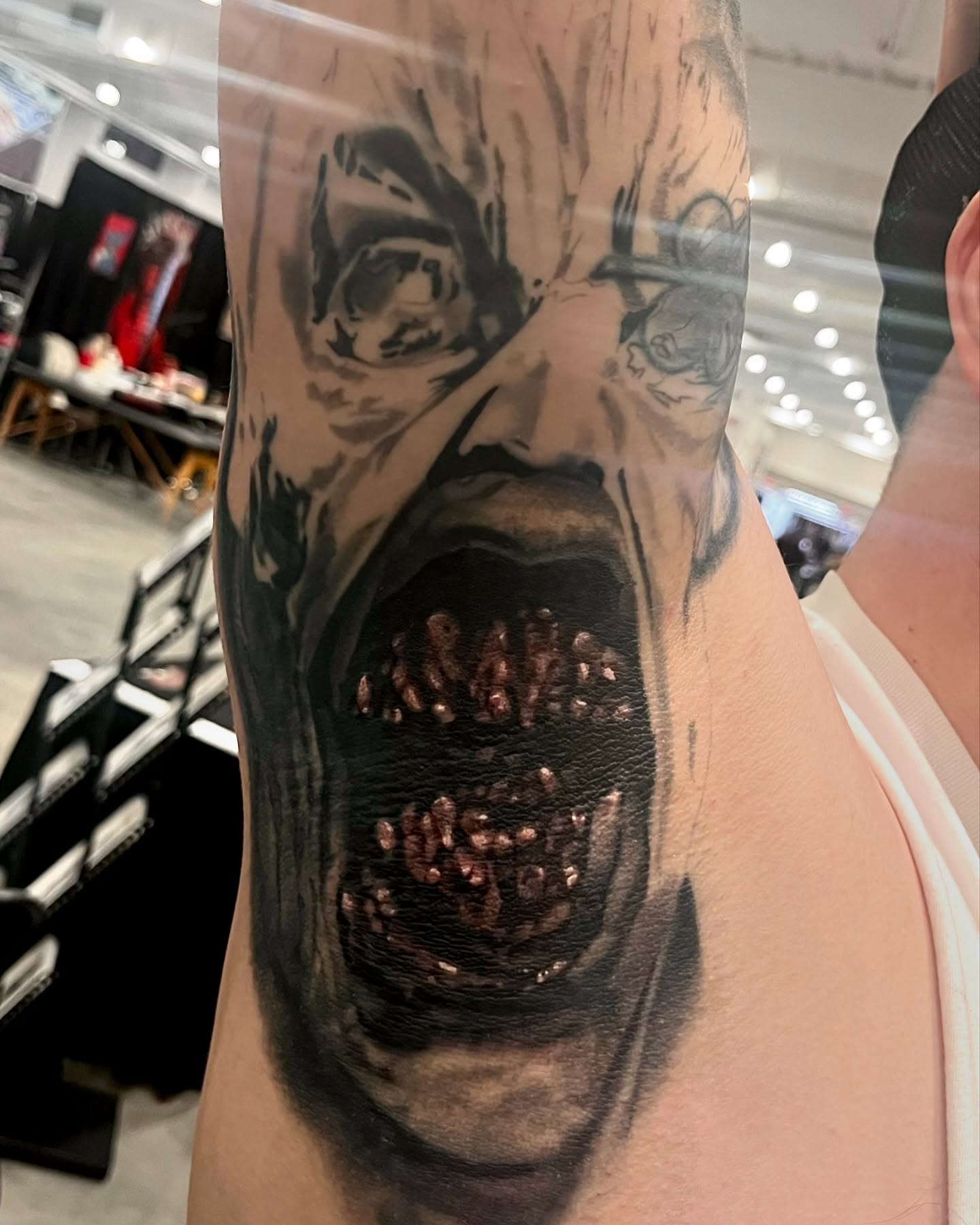 Horror creature dark realism tattoo on the forearm by Brennan Freemantle