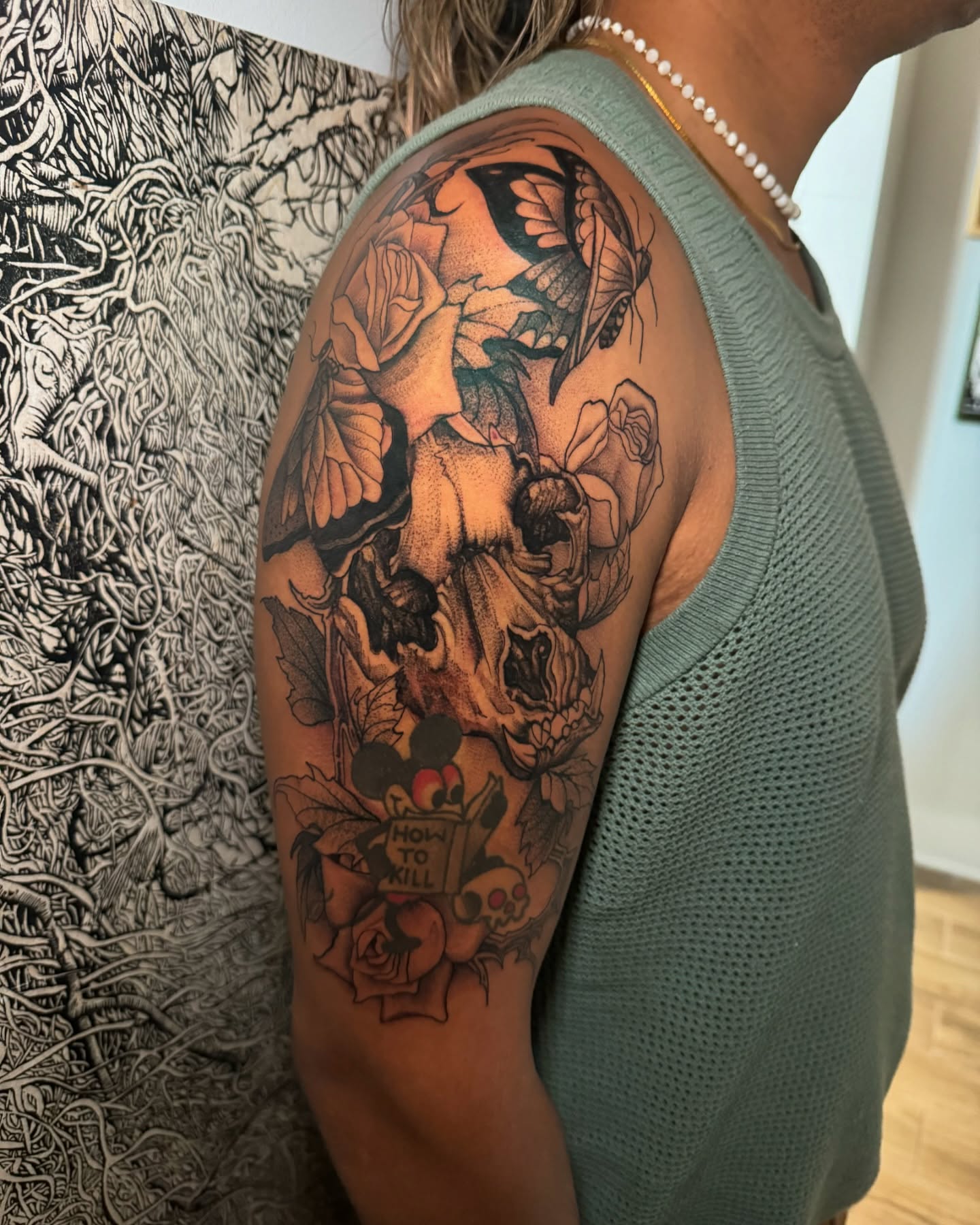 Butterfly and roses dotwork tattoo on the shoulder by Erick Mendivil