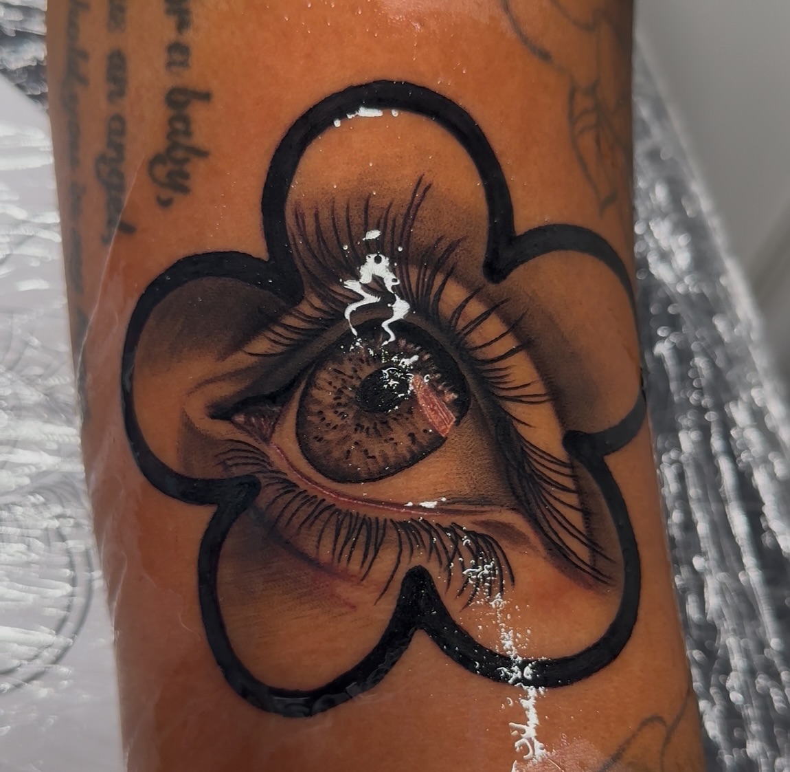 Eye realism tattoo on the forearm by Svetlana