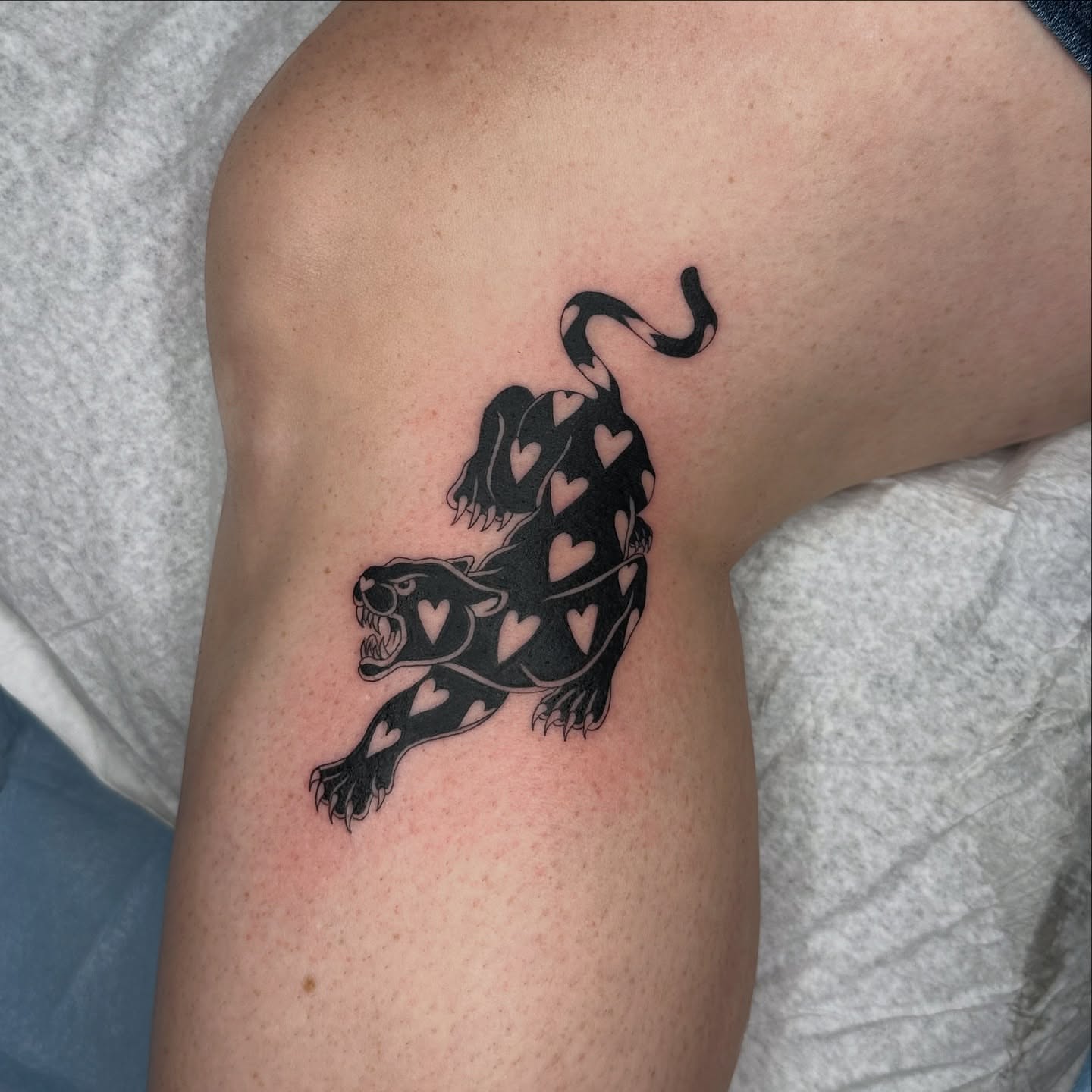 Panther with hearts black and grey tattoo on the thigh by sechi