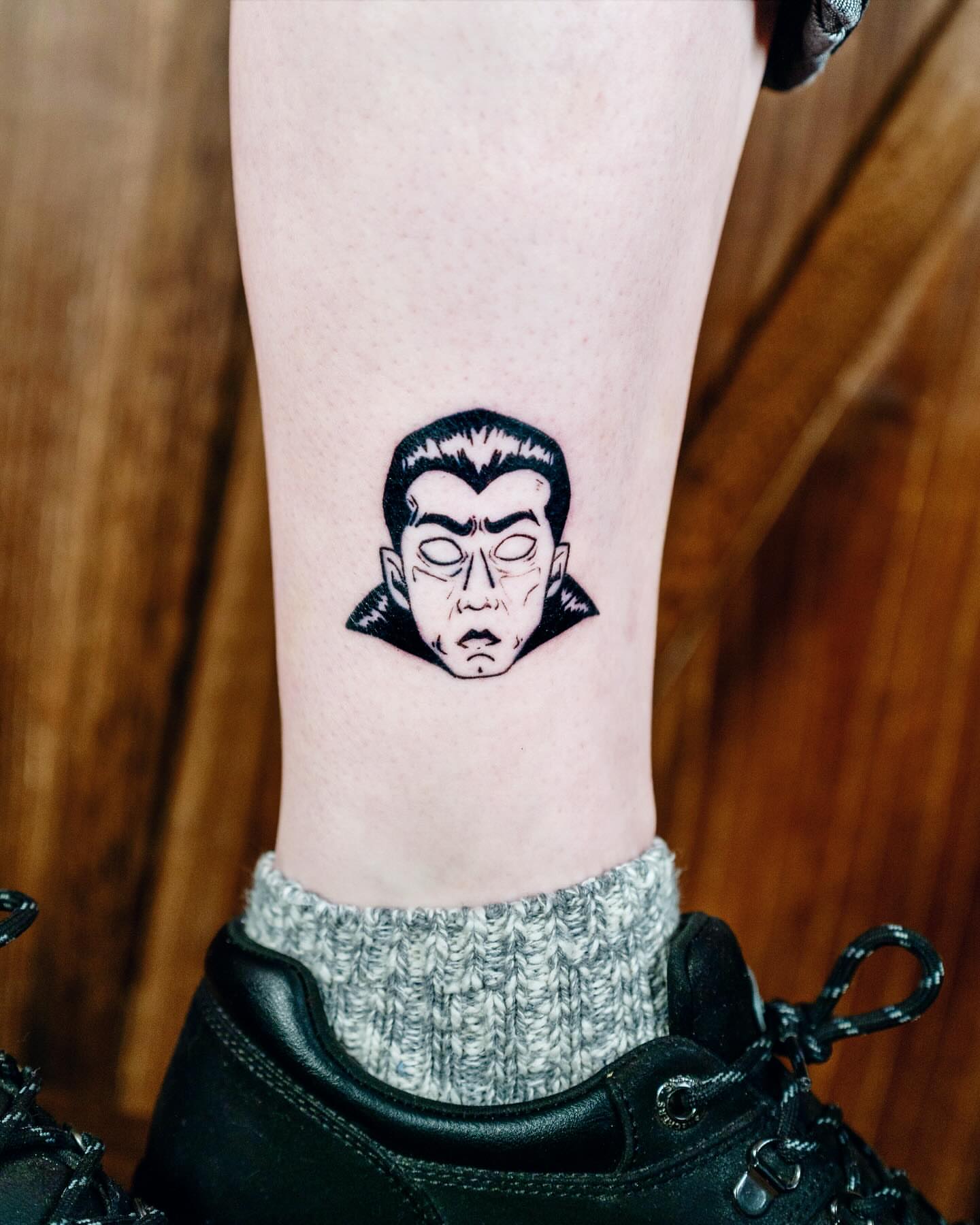 Dracula black and grey tattoo on the forearm by Lex