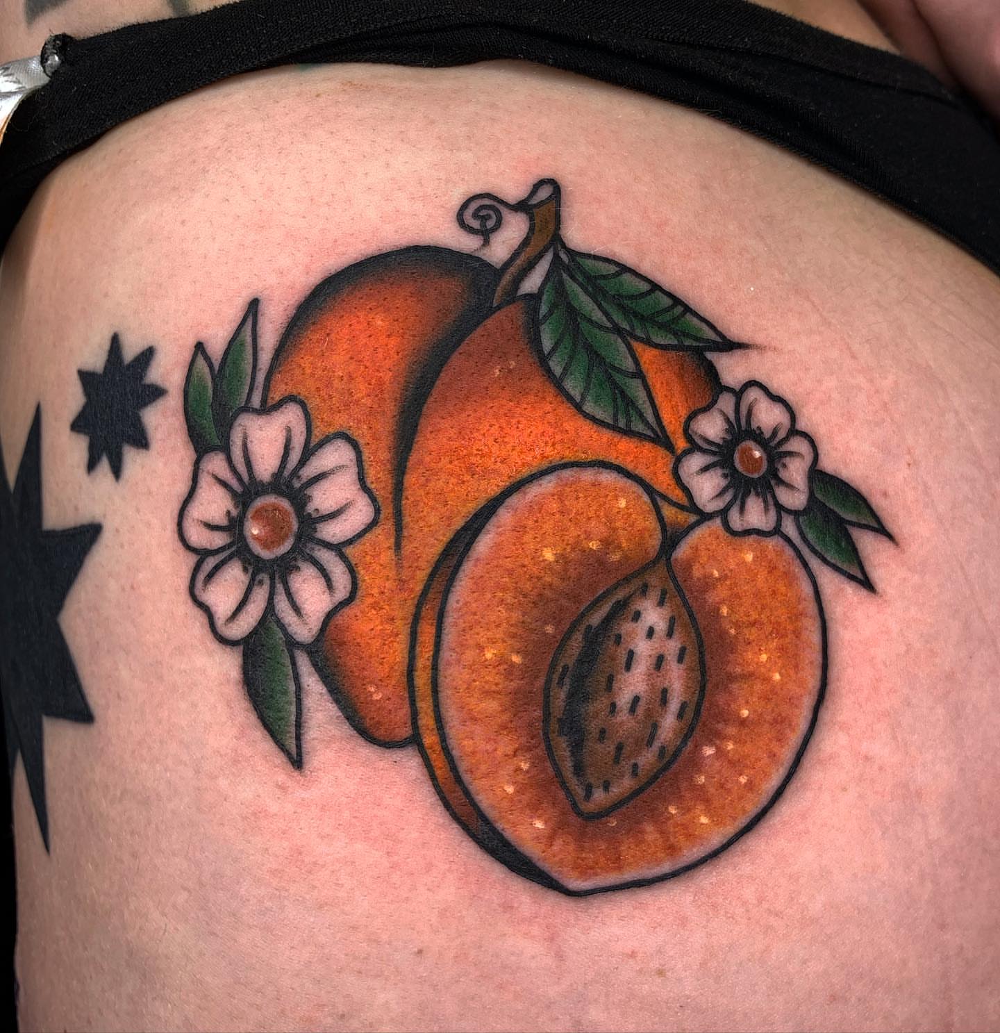 Peach and flowers American traditional tattoo by Brii Moser