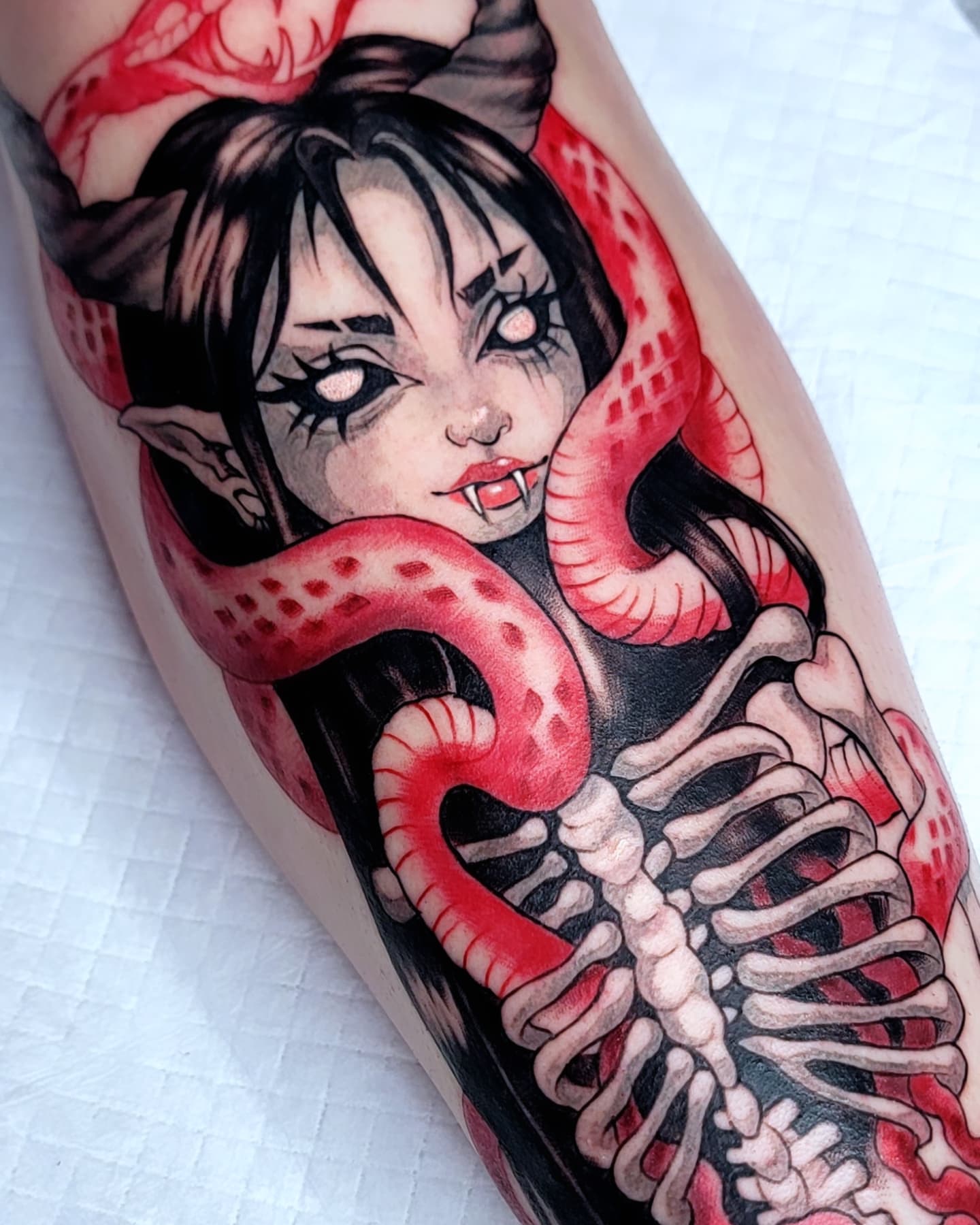 Woman with snake japanese irezumi tattoo on the forearm by Kerry Rose