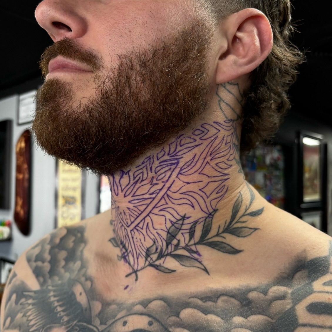 Floral and geometric design geometric tattoo on the neck by Dyllan Shipley