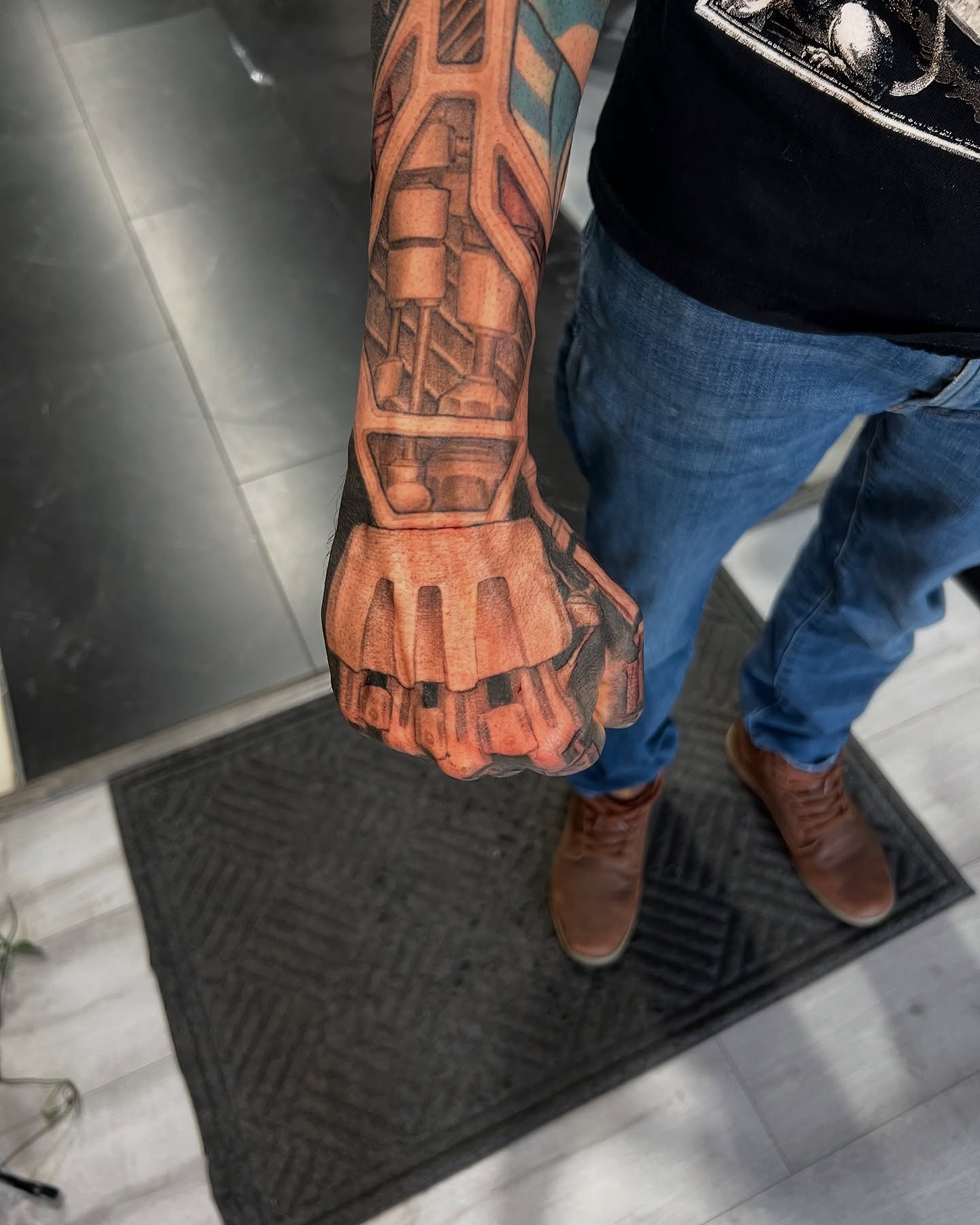 Mechanical hand realism tattoo on the forearm by Mike j tattooer