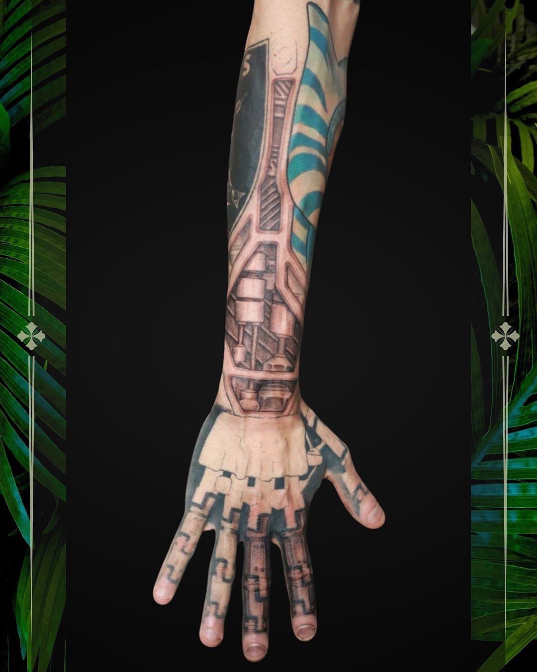 Mechanical hand geometric tattoo on the forearm by Mike j tattooer