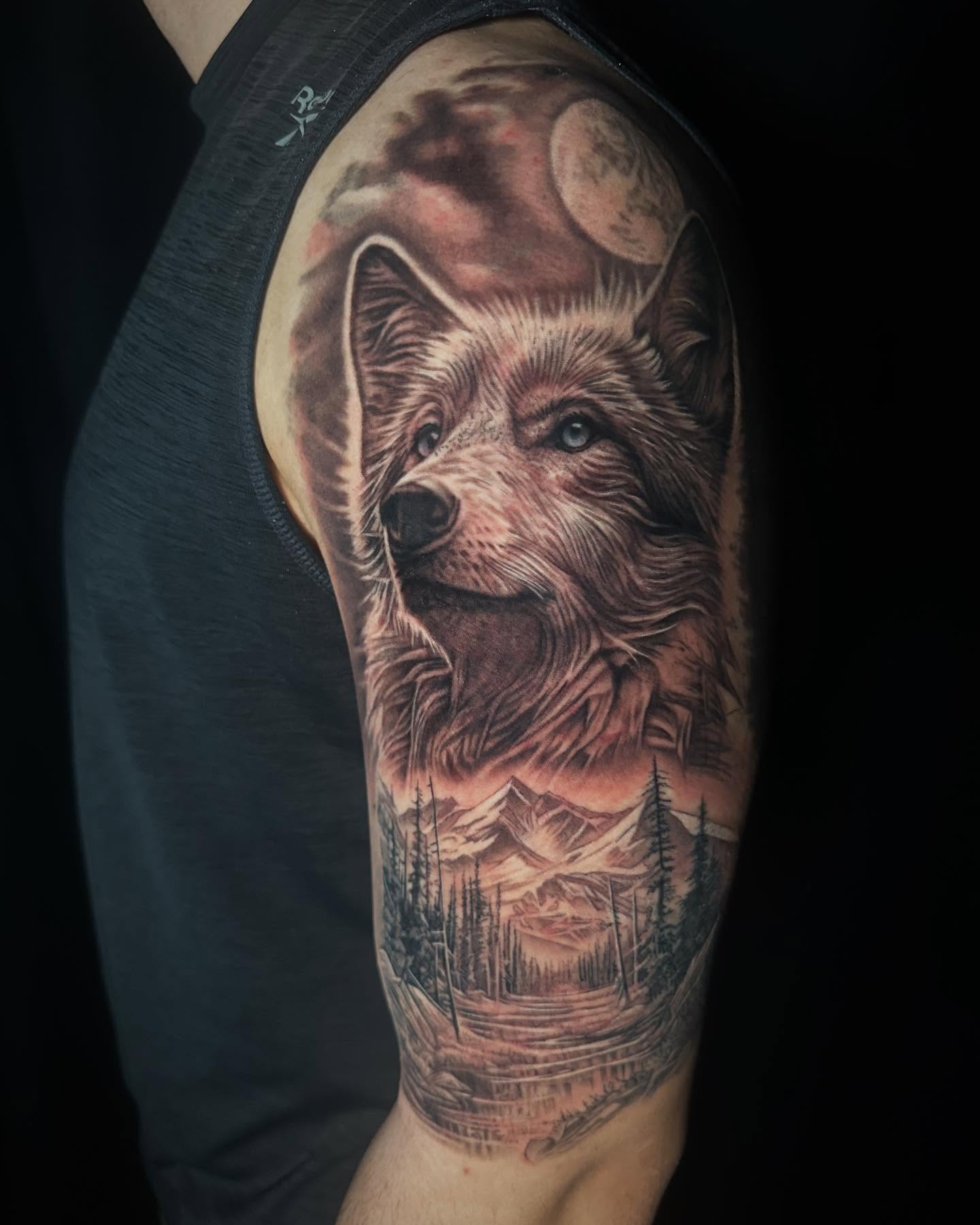 Wolf realism tattoo on the forearm by Jon Gioia