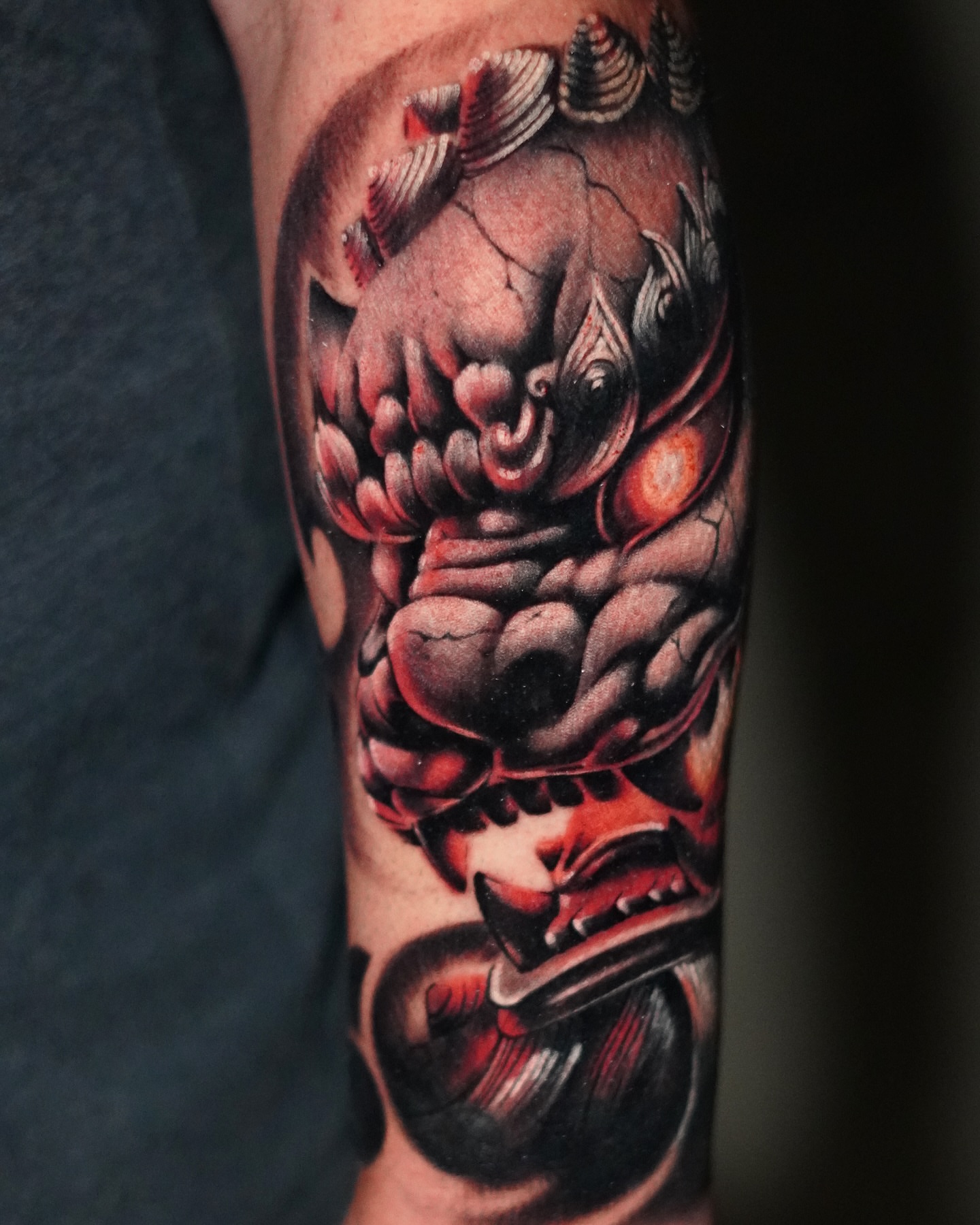 Demon mask dark realism tattoo on the forearm by Angel Gonzalez
