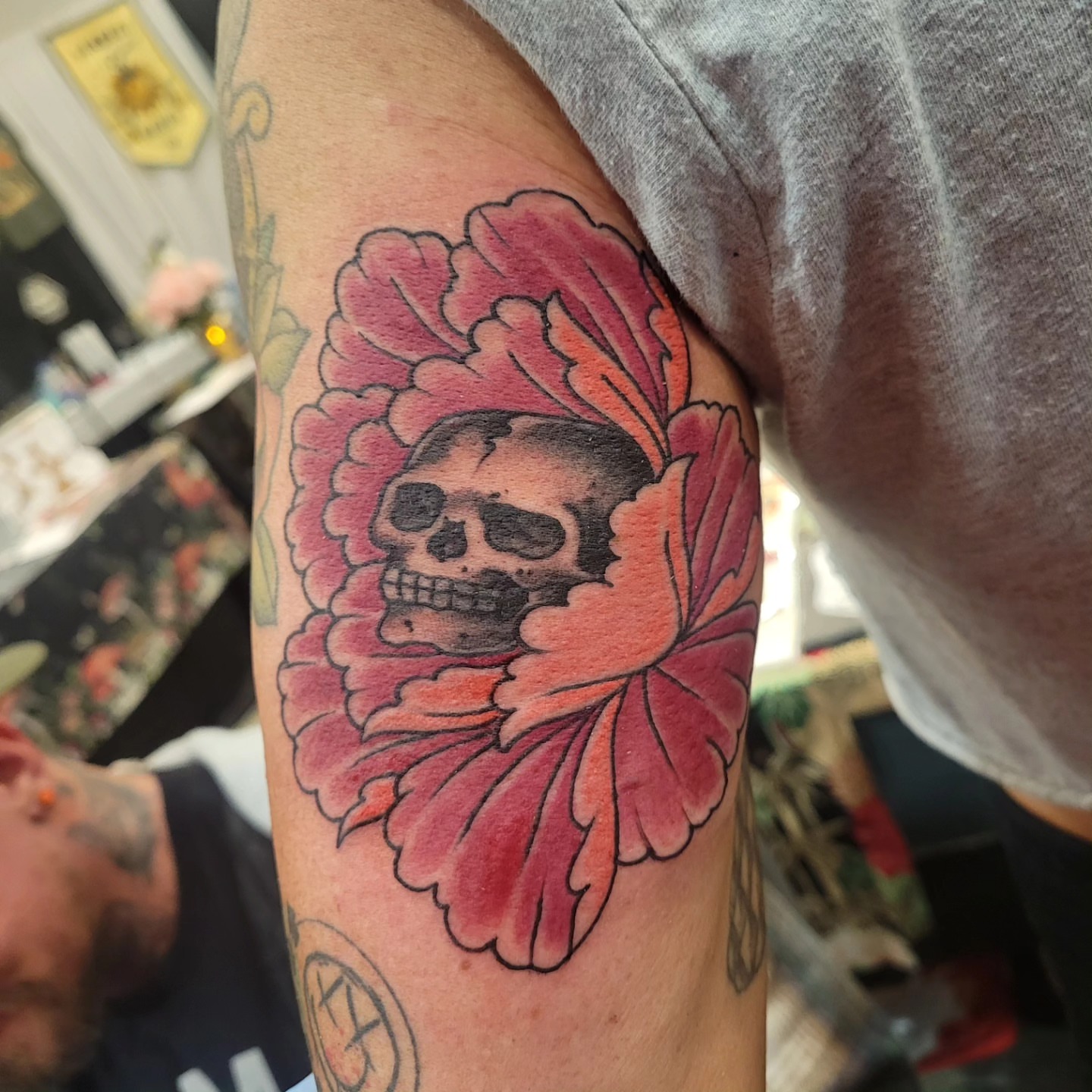 Skull and flower American traditional tattoo on the forearm by Mark Harada, Hoboken, New Jersey