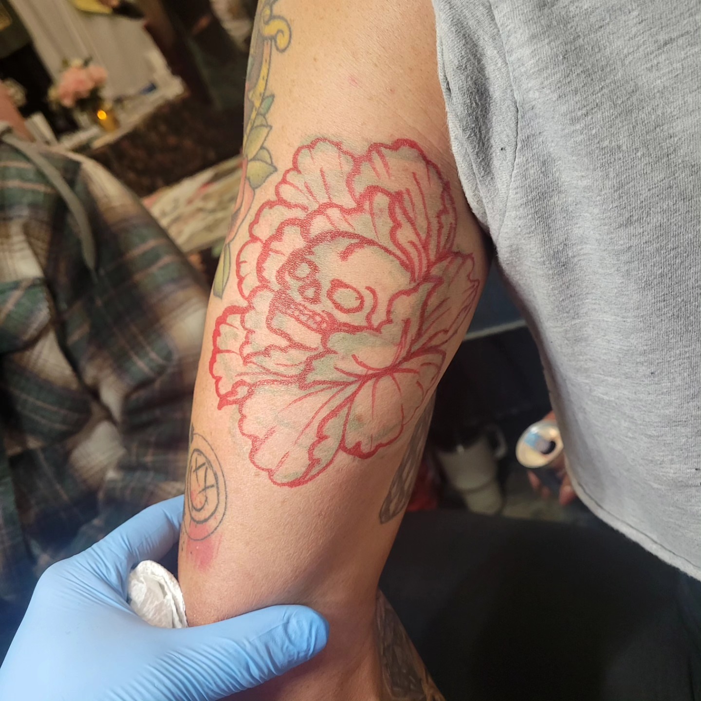 Peony American traditional tattoo on the forearm by Mark Harada, Hoboken, New Jersey
