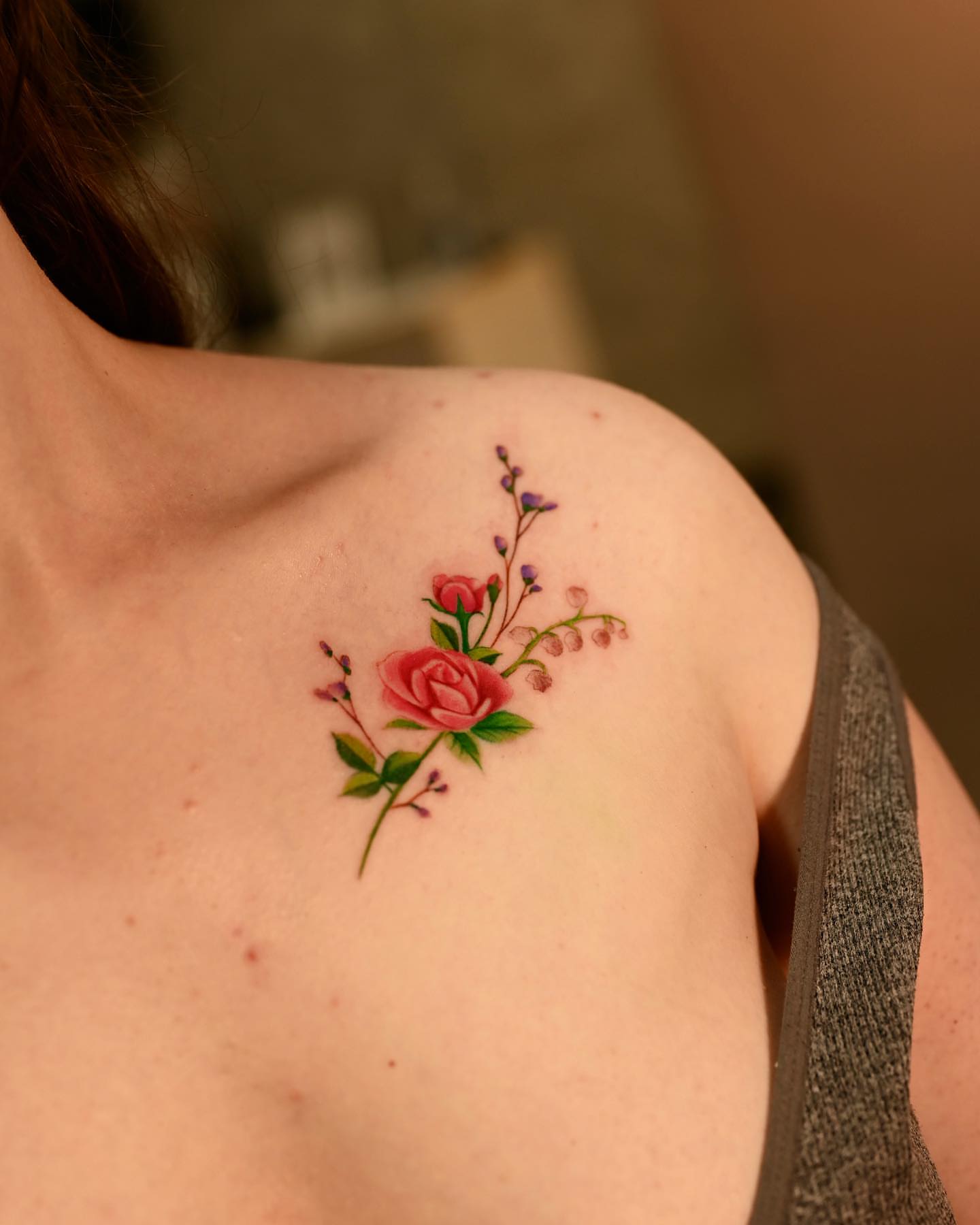 Flower bouquet realism tattoo on the shoulder by Navei