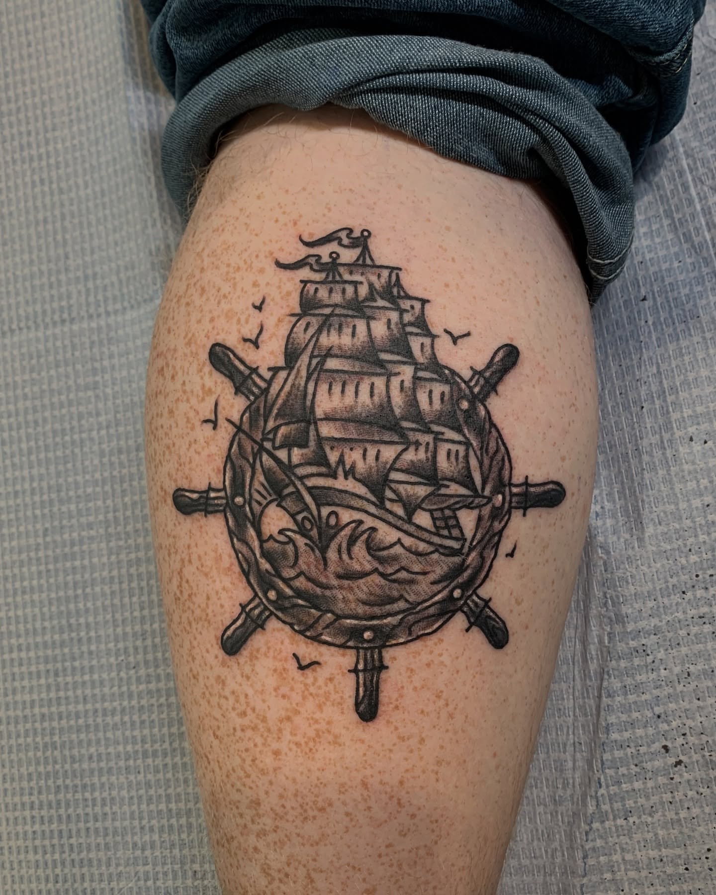 Ship and wheel black and grey tattoo on the thigh by ✞ Keath Supsic ✞