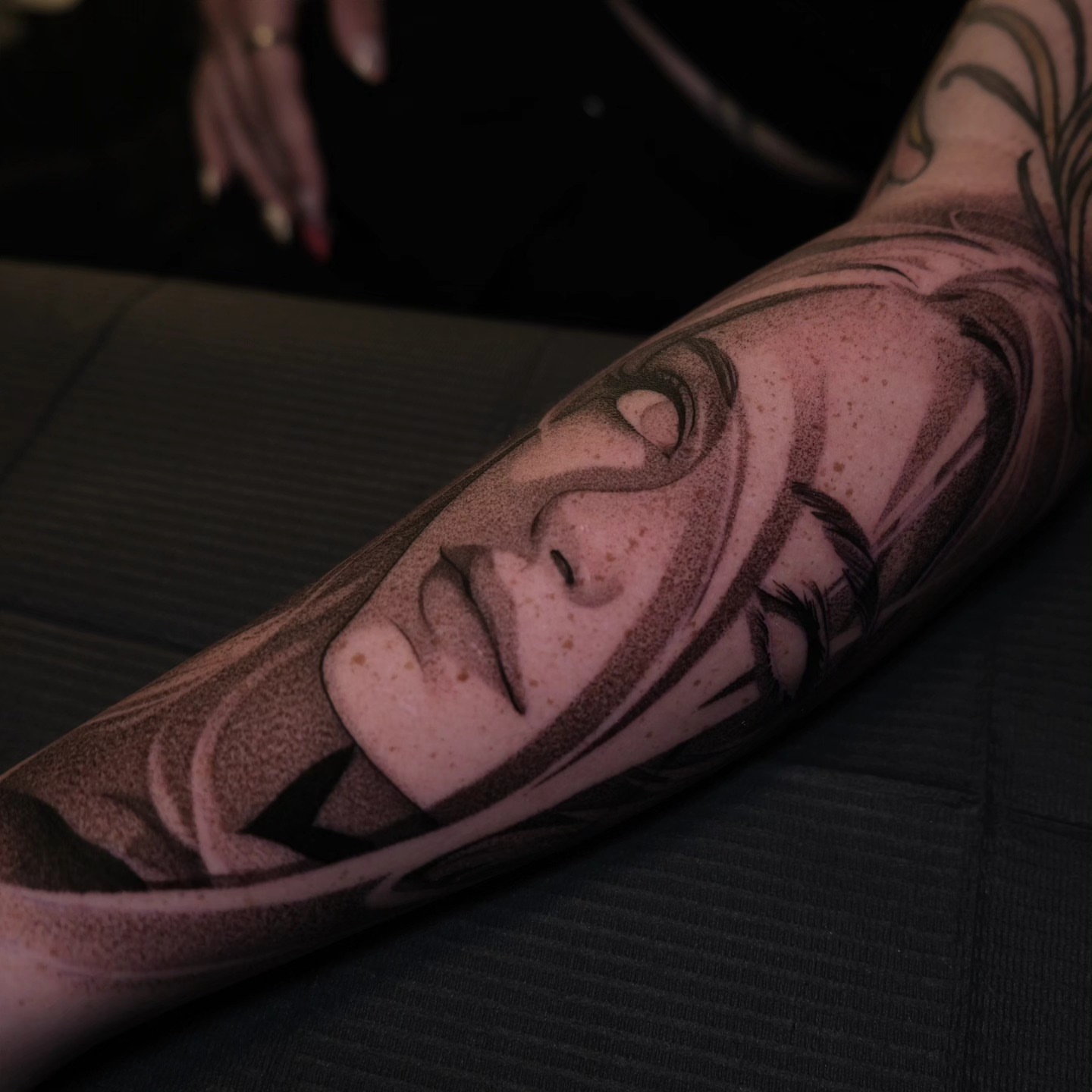 Face dotwork tattoo on the forearm by Ana Fajardo