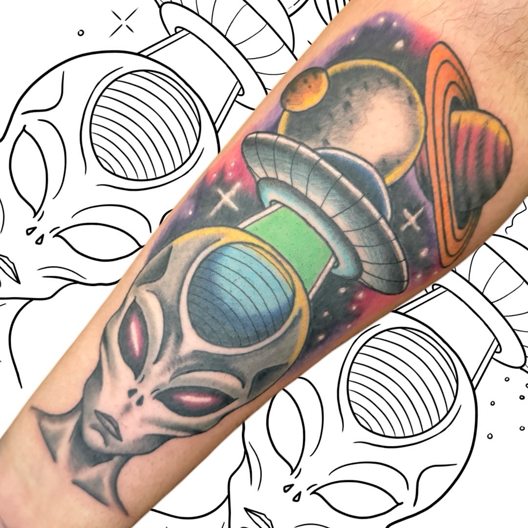 Alien skull with spaceship geometric tattoo on the forearm by Victor Campos