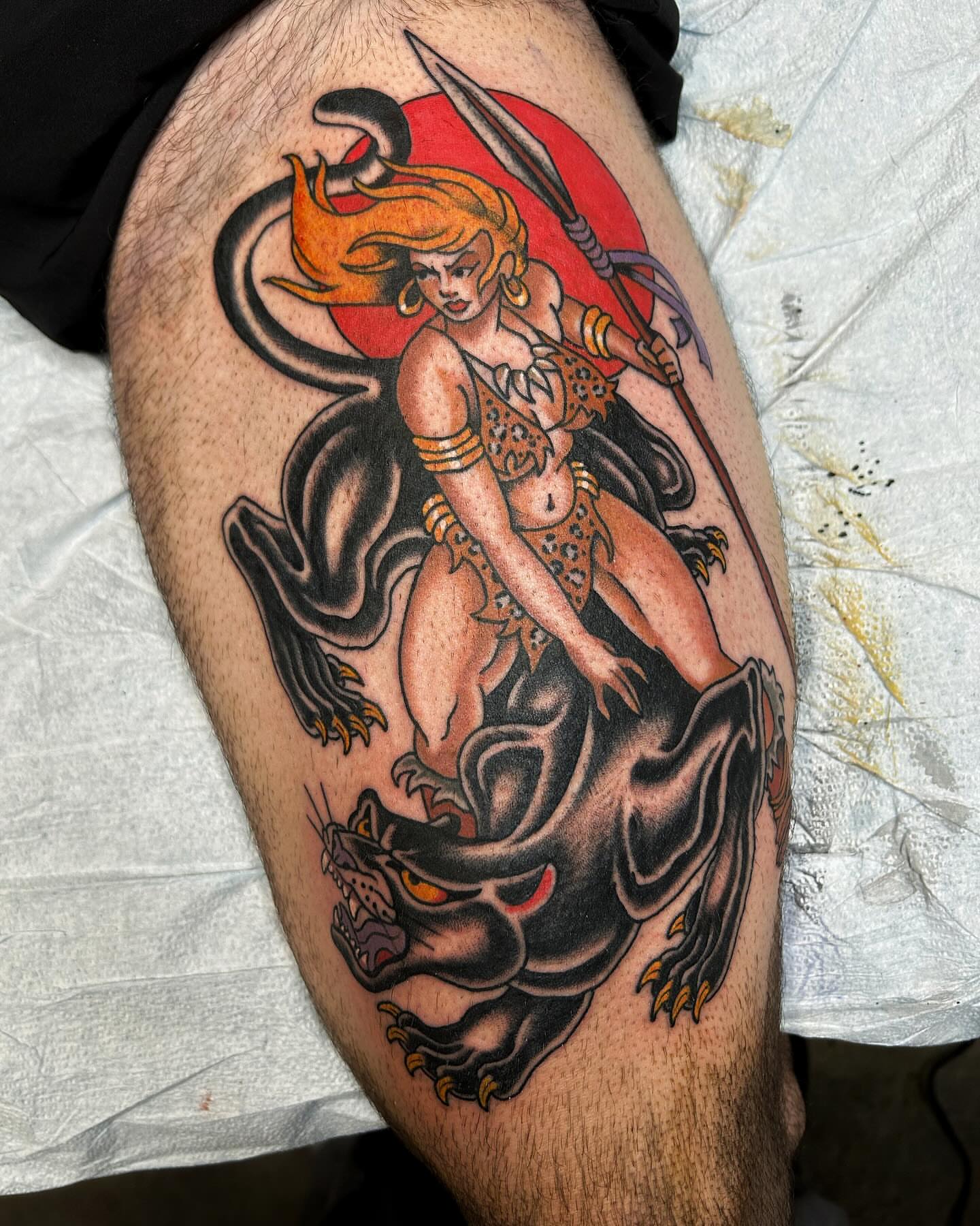 Woman riding panther American traditional tattoo on the thigh by Jade McKenzie, Temecula, California