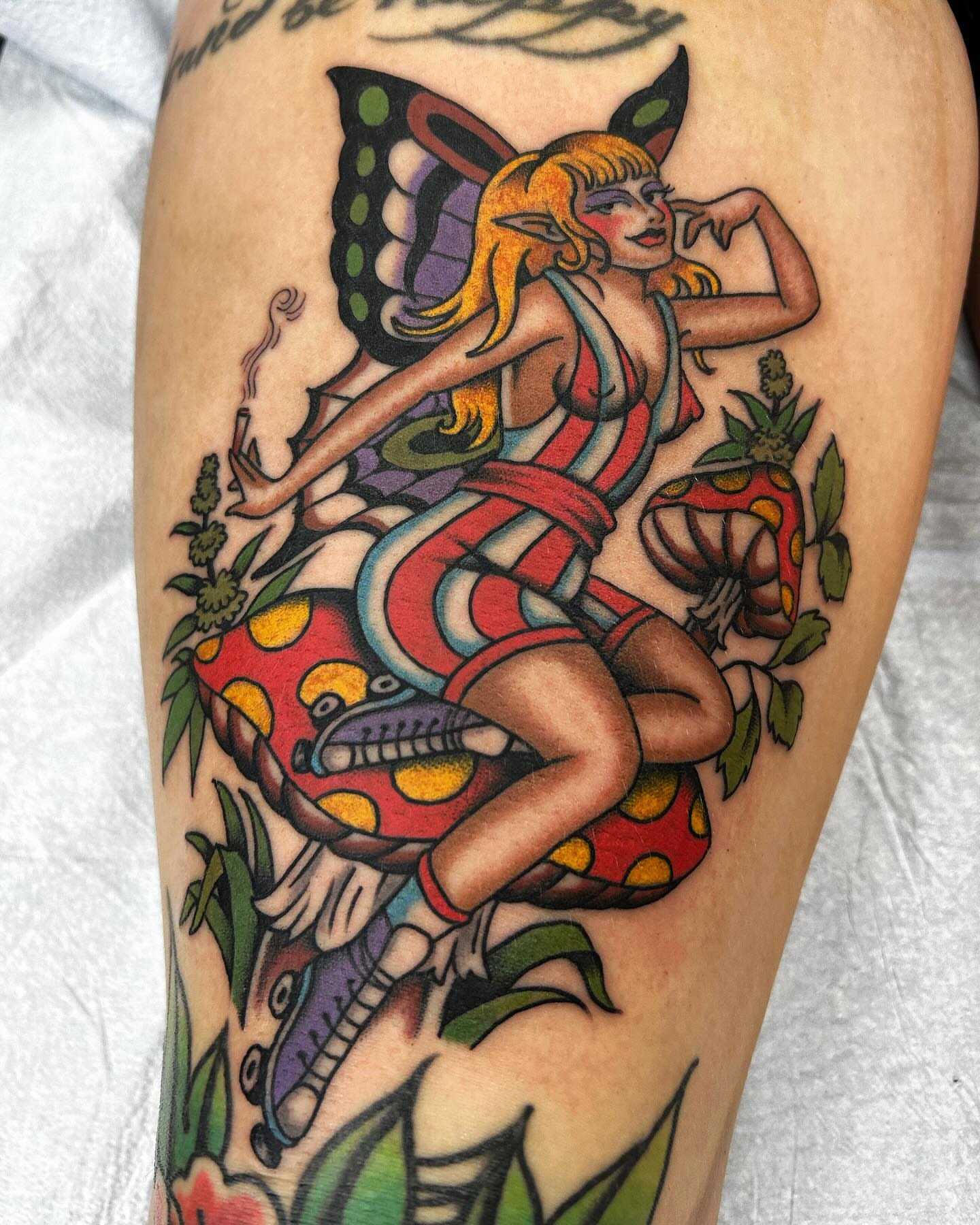 Elf fairy riding mushroom American traditional tattoo on the thigh by Jade McKenzie, Temecula, California