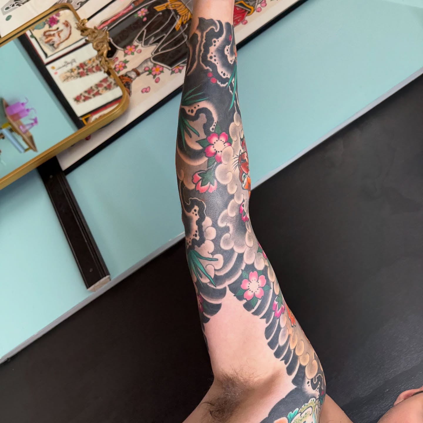 Cherry blossoms and clouds japanese irezumi tattoo on the forearm by DemianThompson