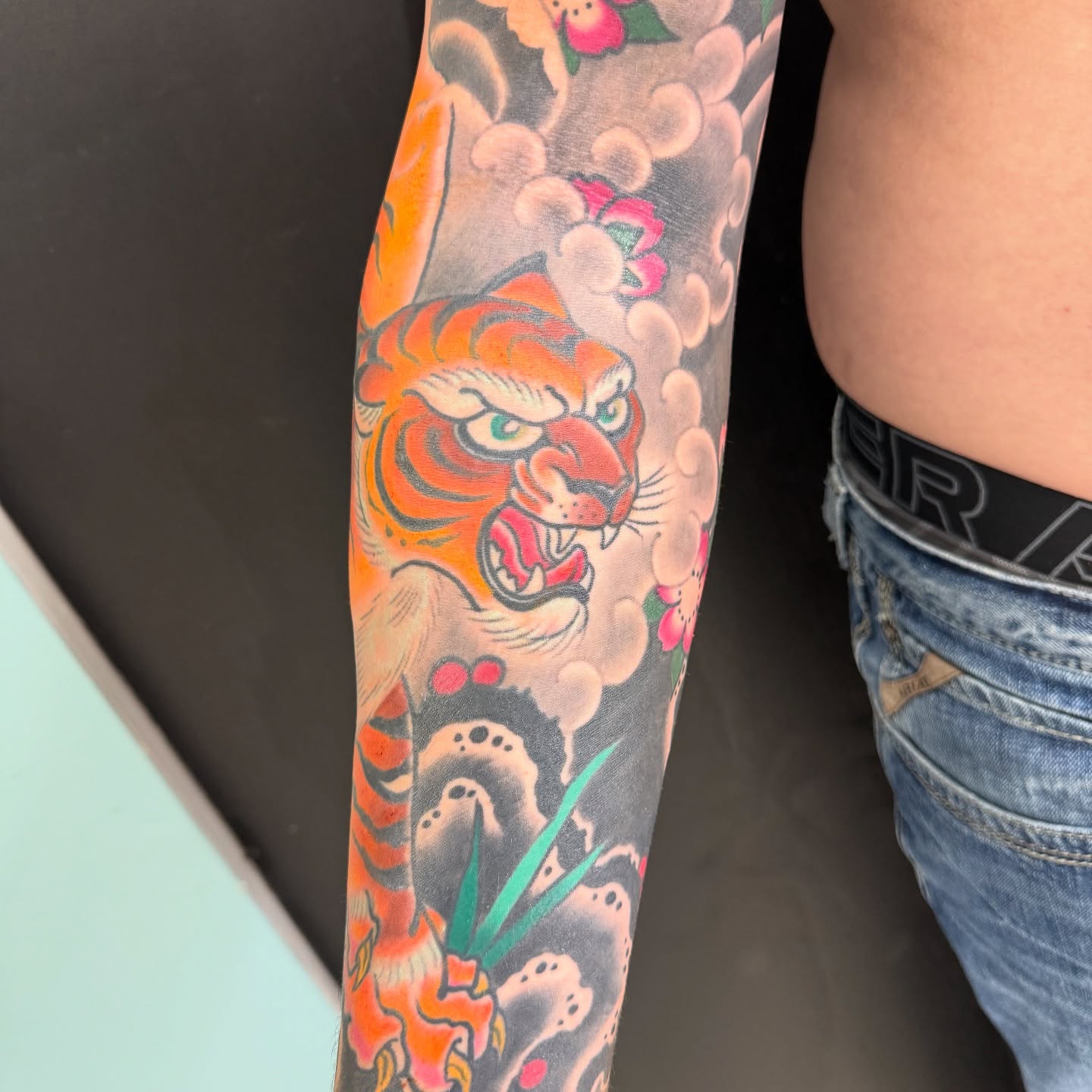 Tiger American traditional tattoo on the forearm by DemianThompson