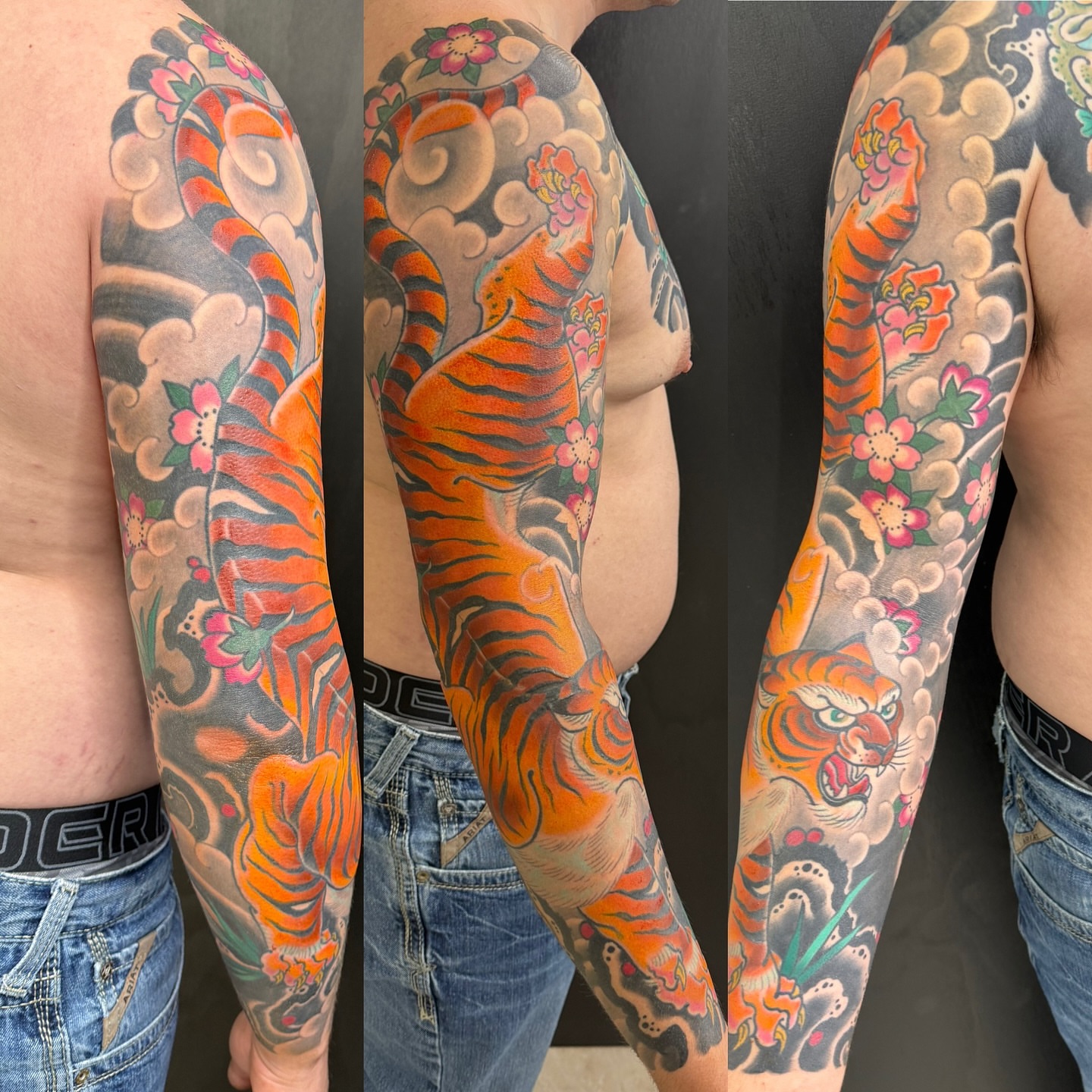 Tiger and floral japanese irezumi tattoo on the upper arm by DemianThompson