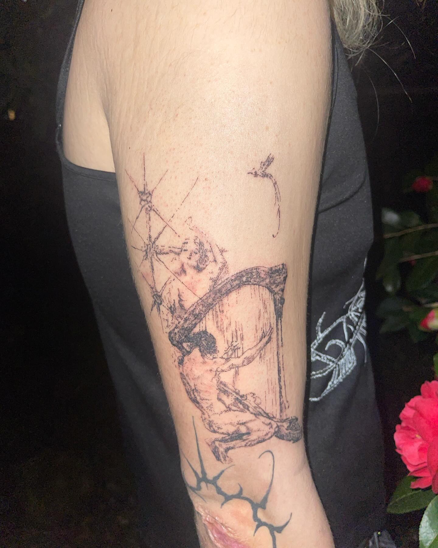 Musician playing harp black and grey tattoo on the forearm by @initiationoftorture