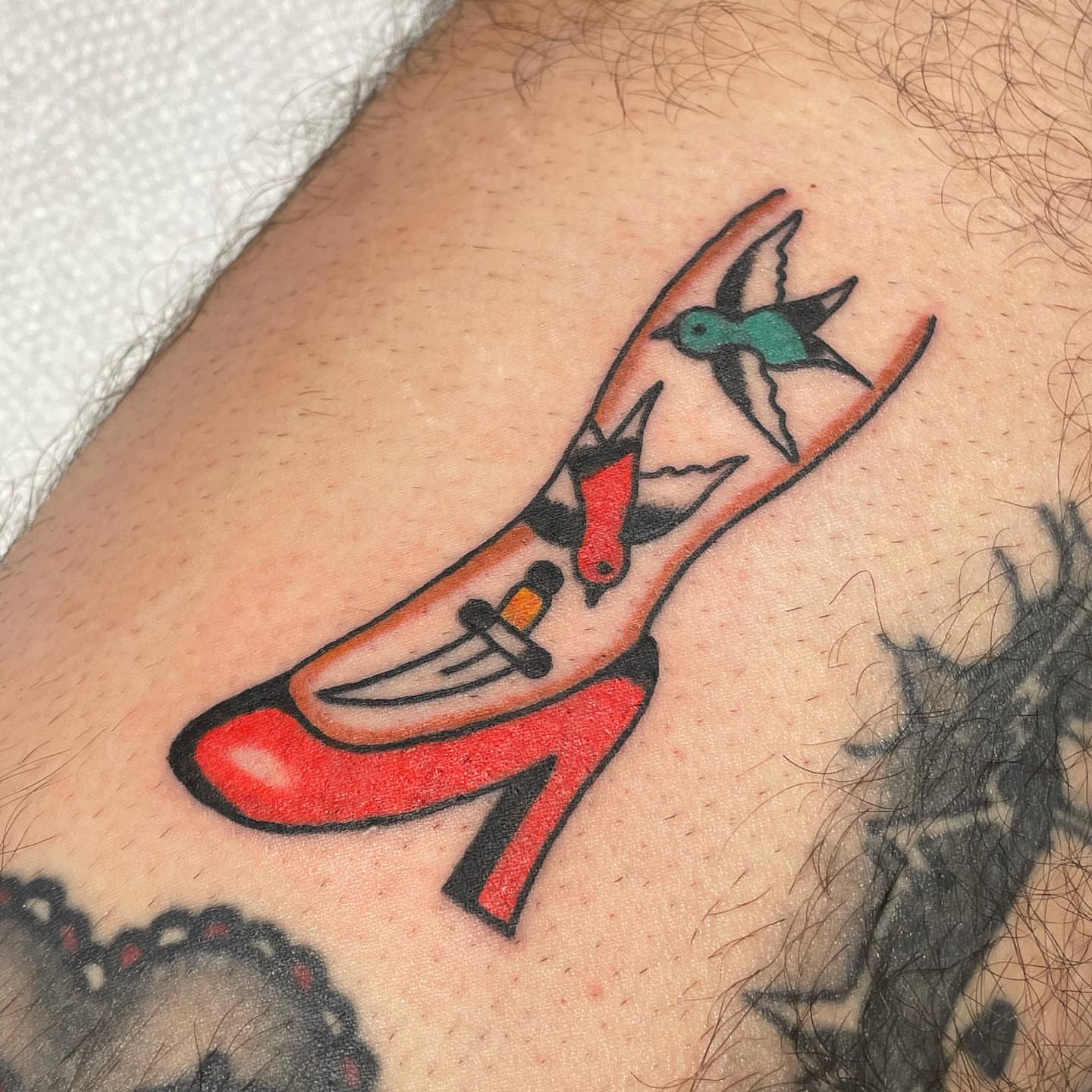 Red high heel shoe American traditional tattoo on the thigh by nancy❣️