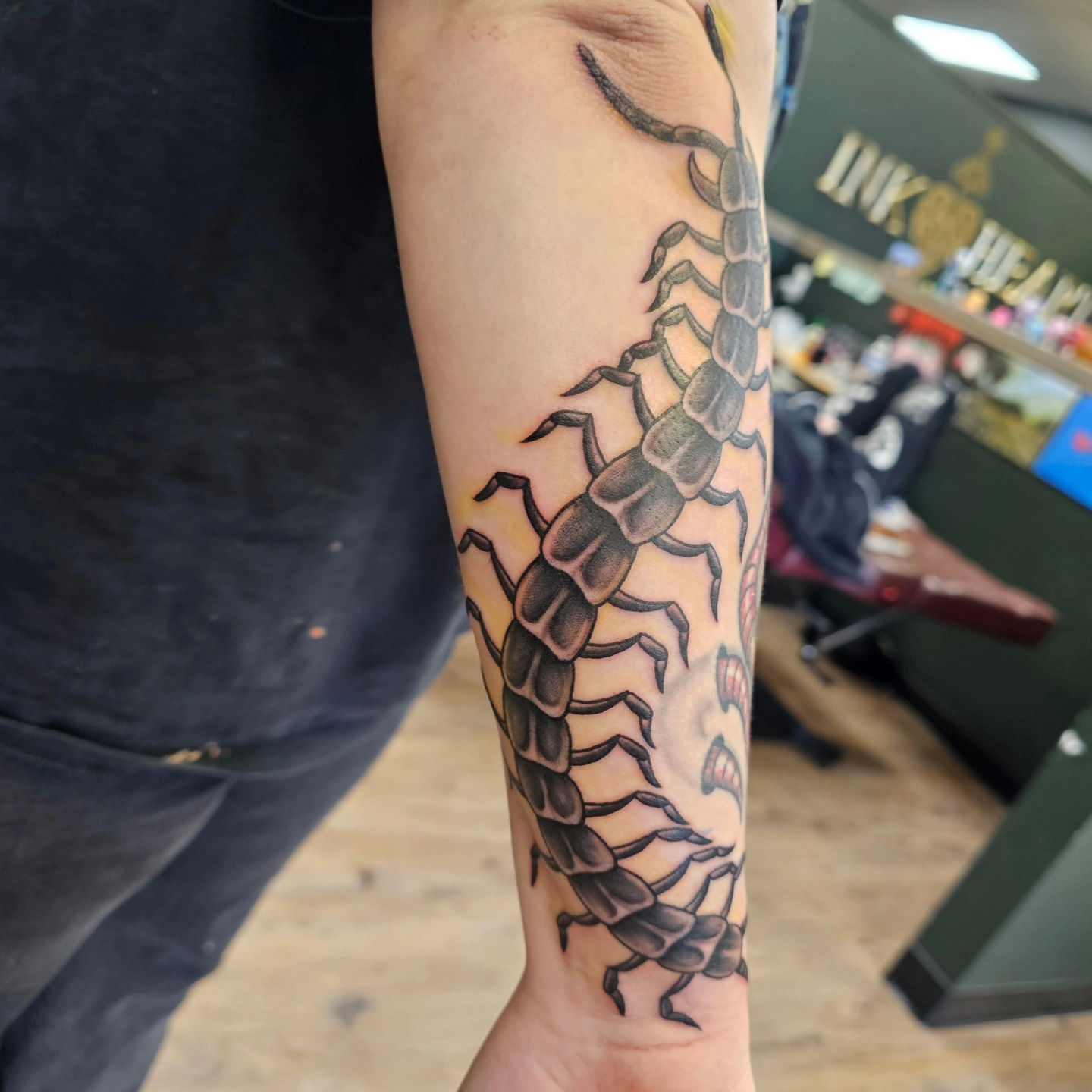 Centipede realism tattoo on the forearm by Derek Davis