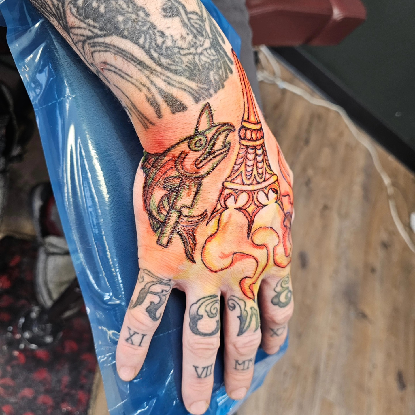 Fox and tower American traditional tattoo on the hand by Derek Davis