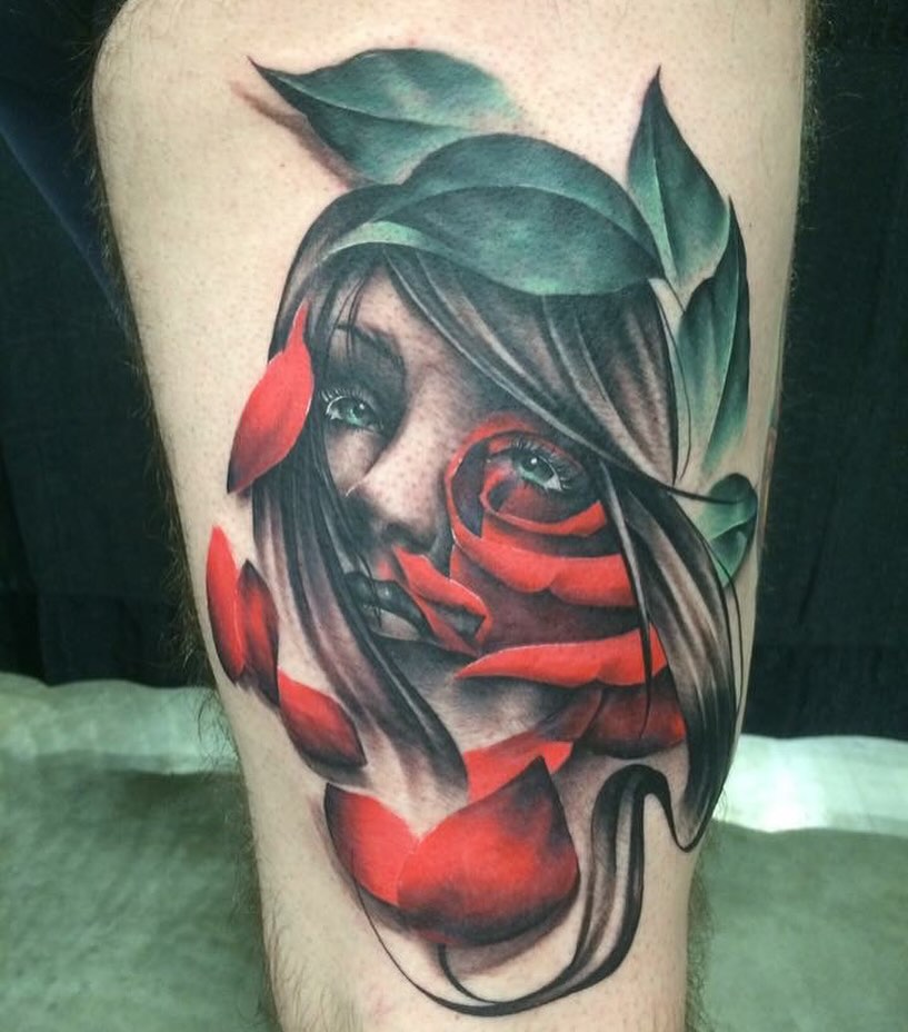 Woman with rose realism tattoo on the thigh by Keith (KAM) Miller
