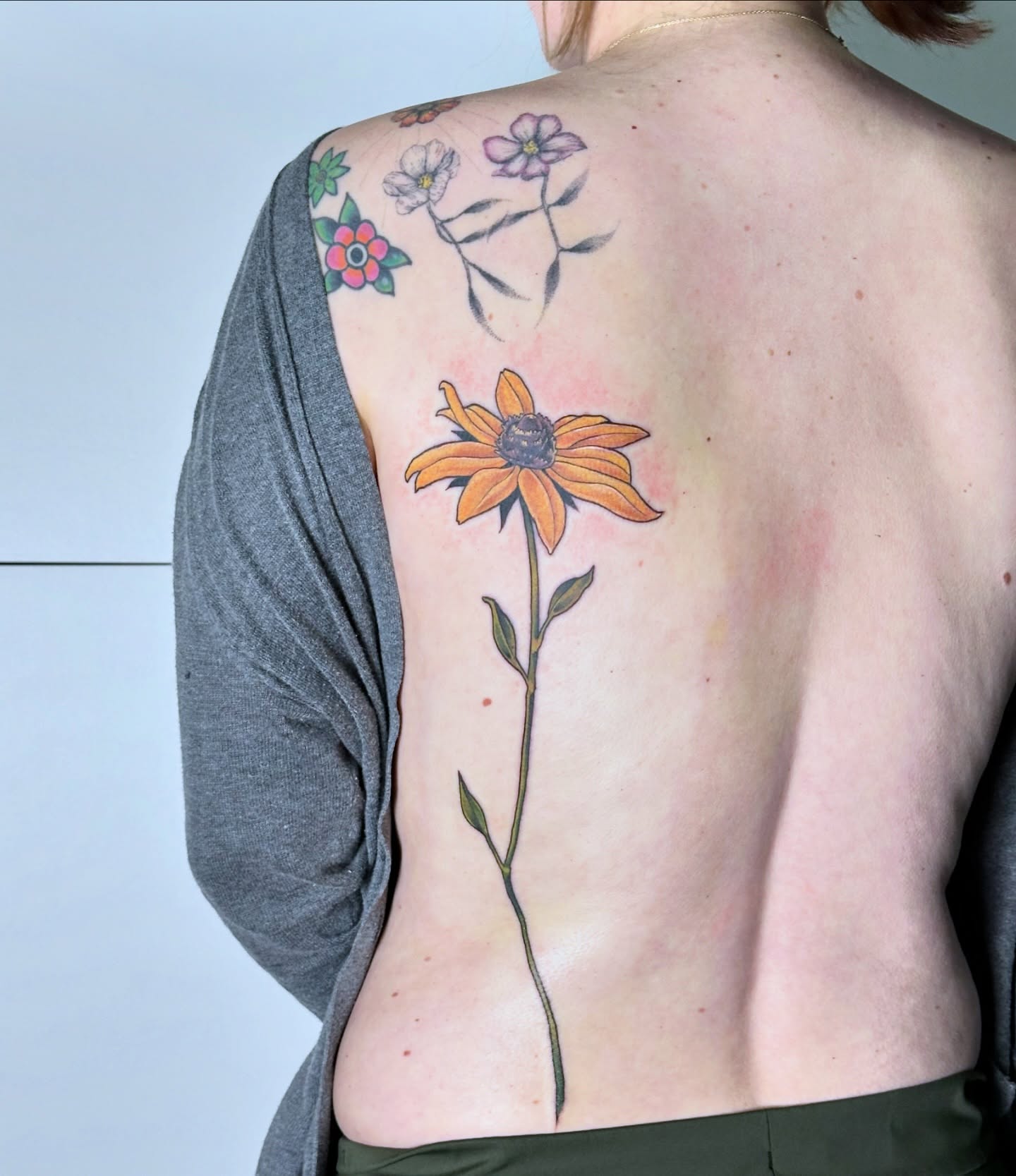 Flower realism tattoo on the back by Sarah Bobby, Houston, Texas