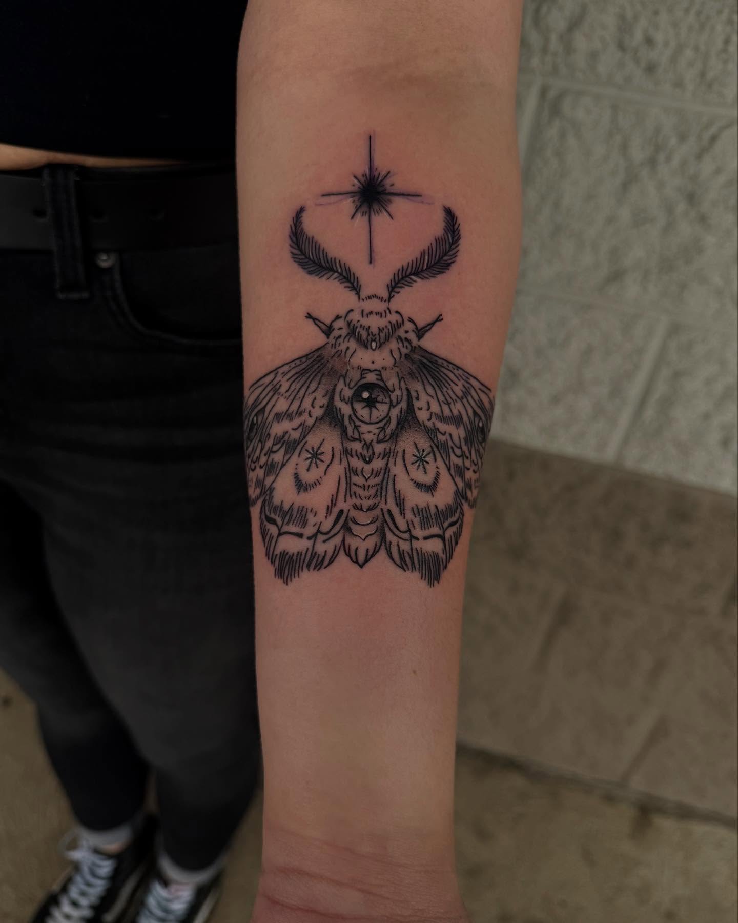 Moth black and grey tattoo on the forearm by Kylee langford 🧿